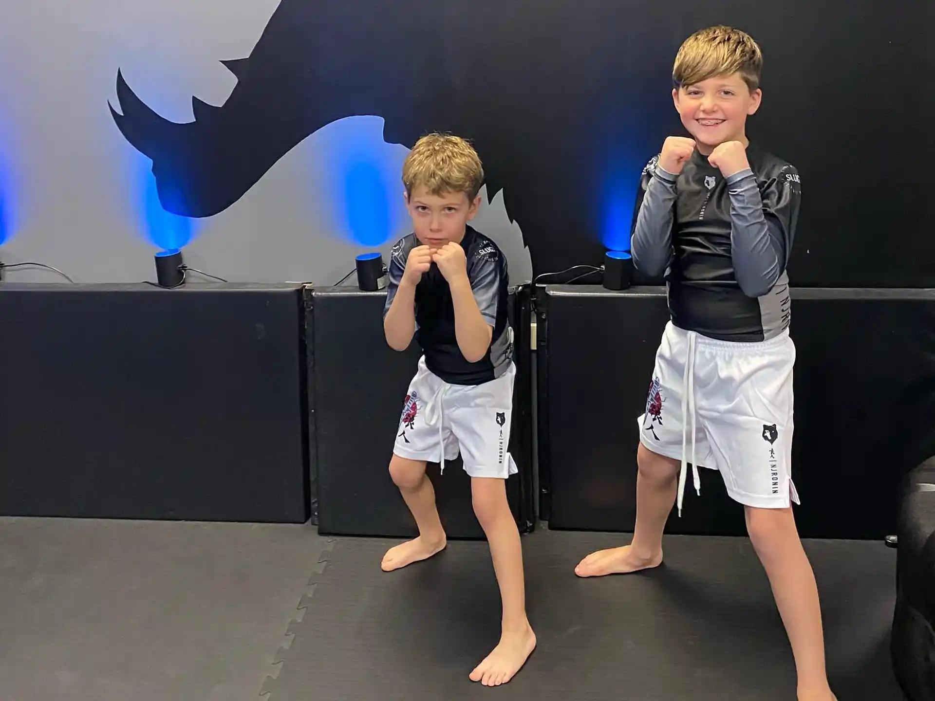 two boys standing on a stage