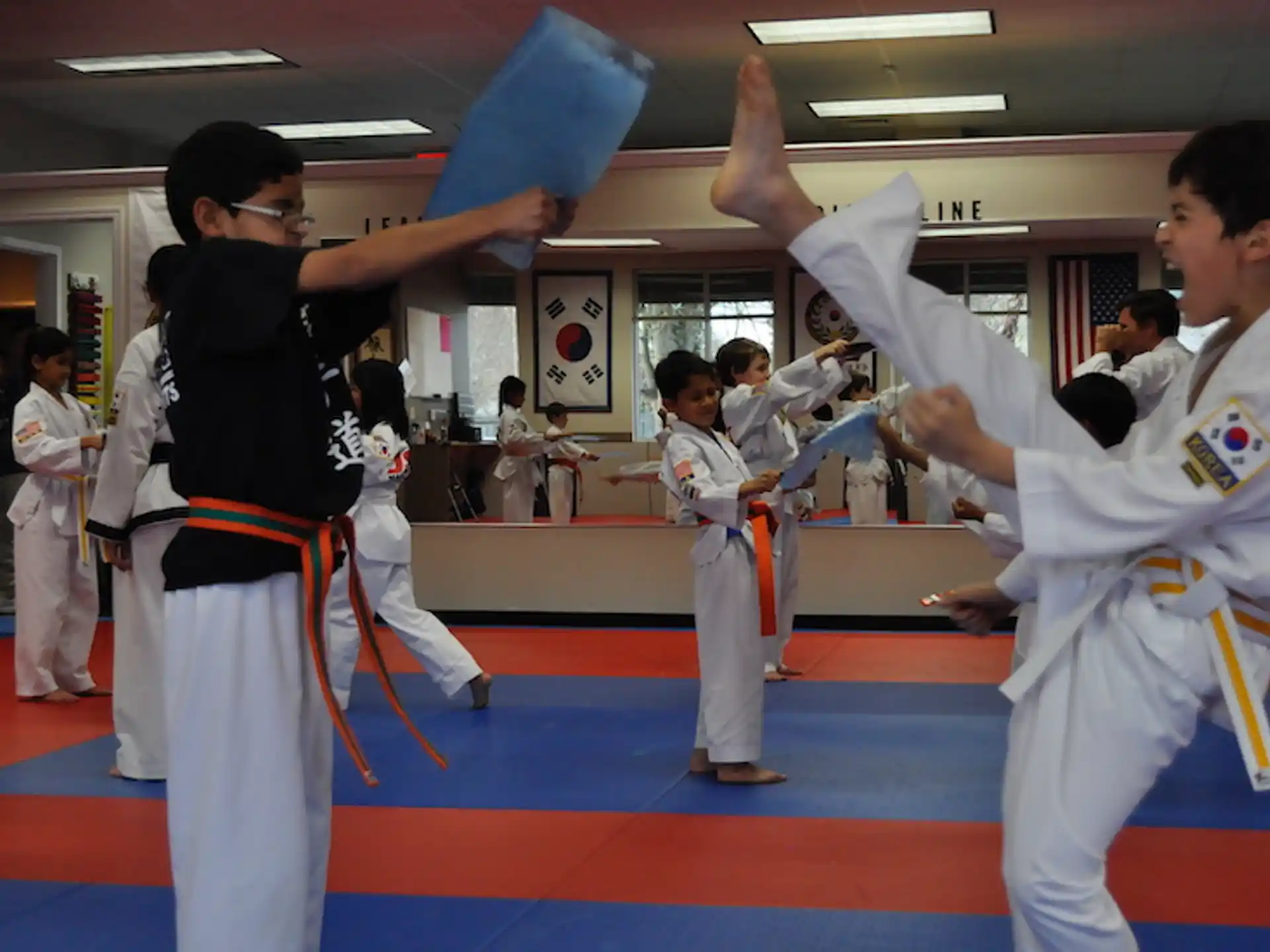 a group of people in karate uniforms