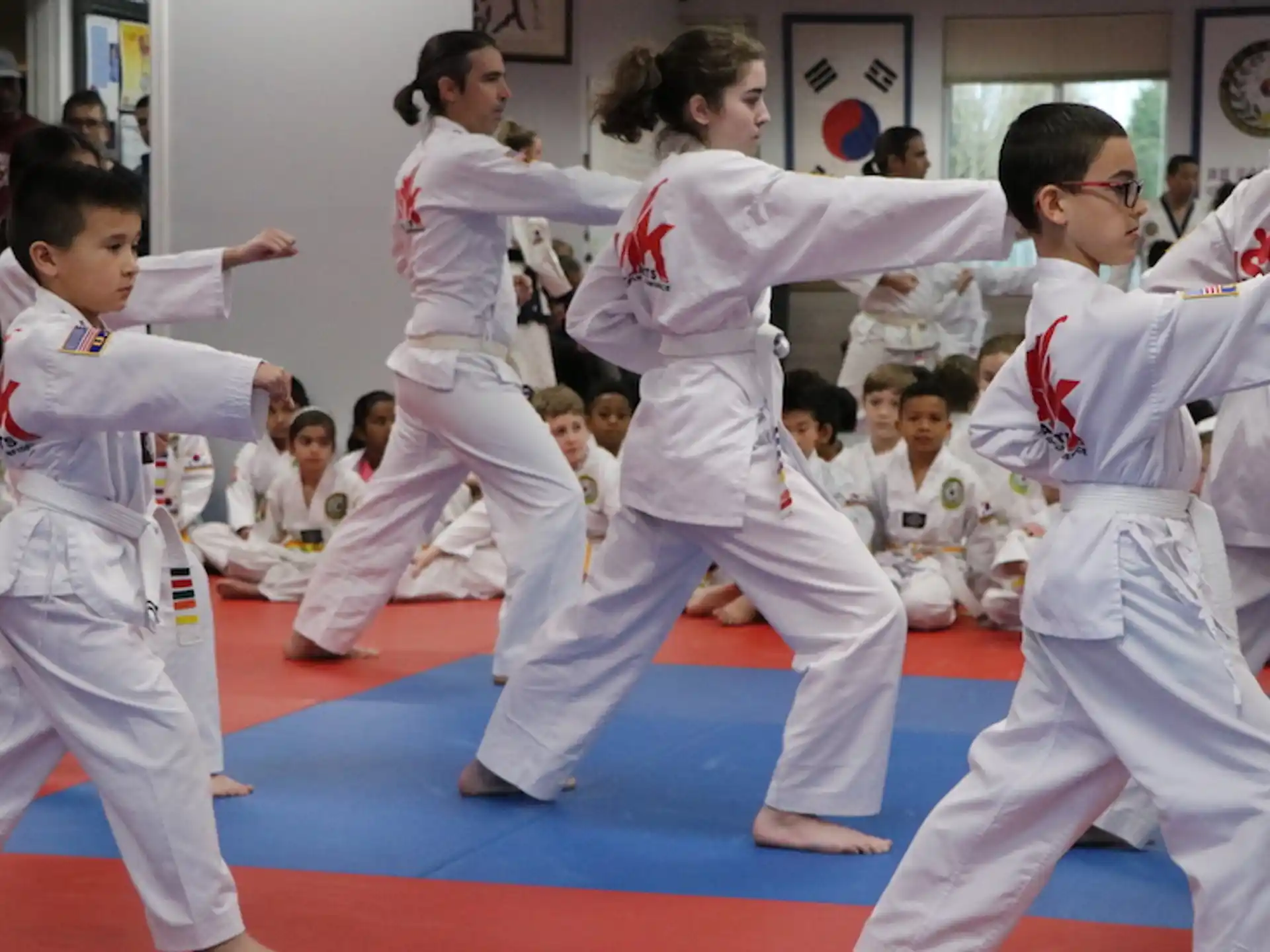 a group of people in karate uniforms