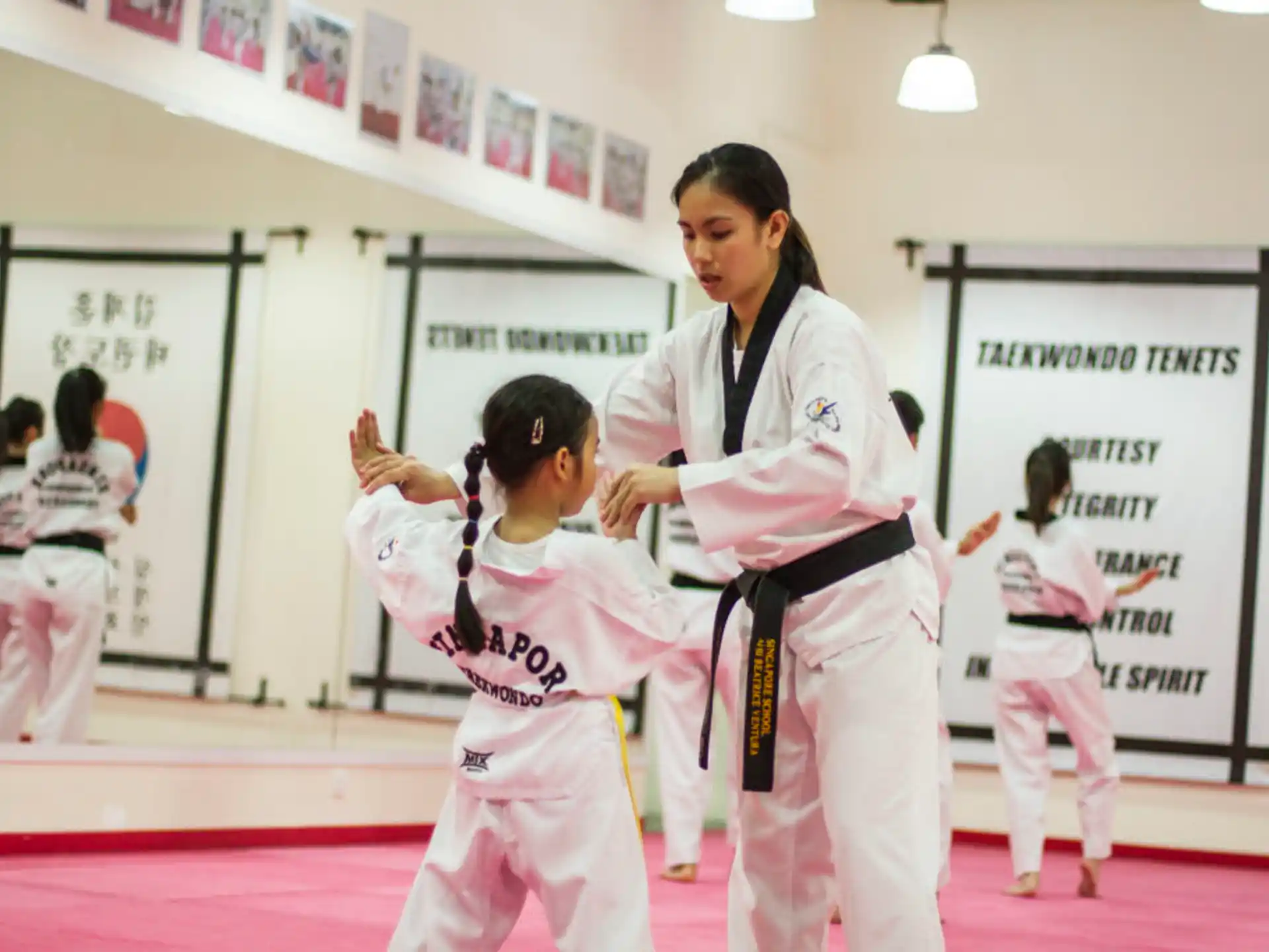 a group of people in karate uniforms