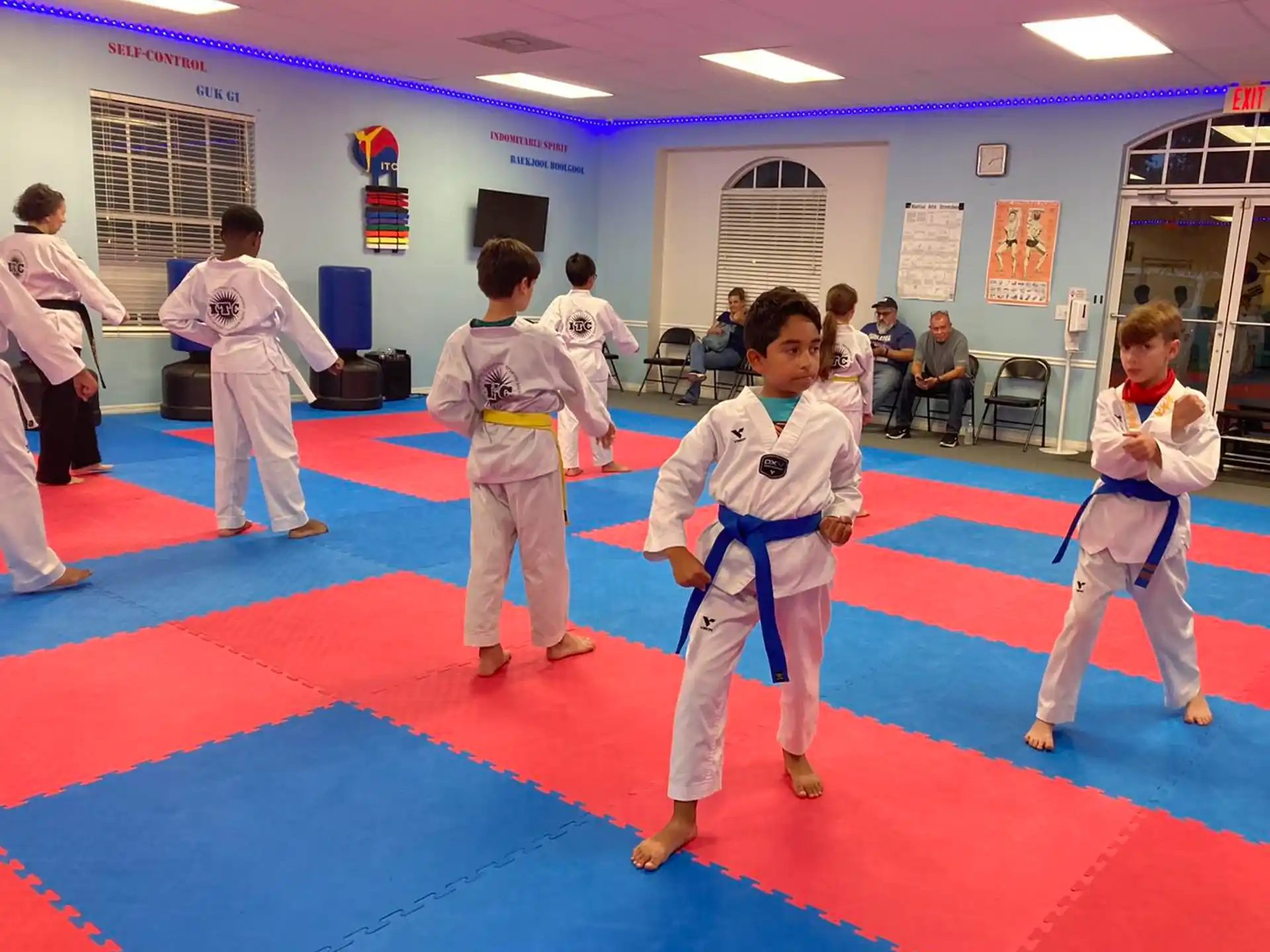 a group of people in karate uniforms