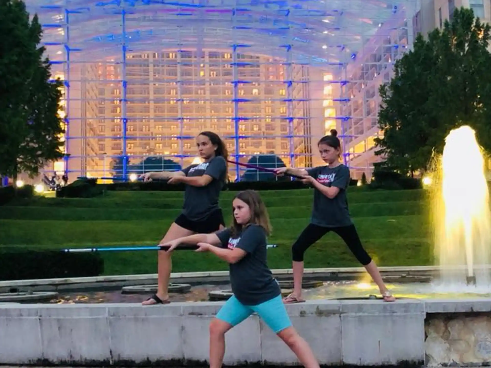 a group of people running in front of a building