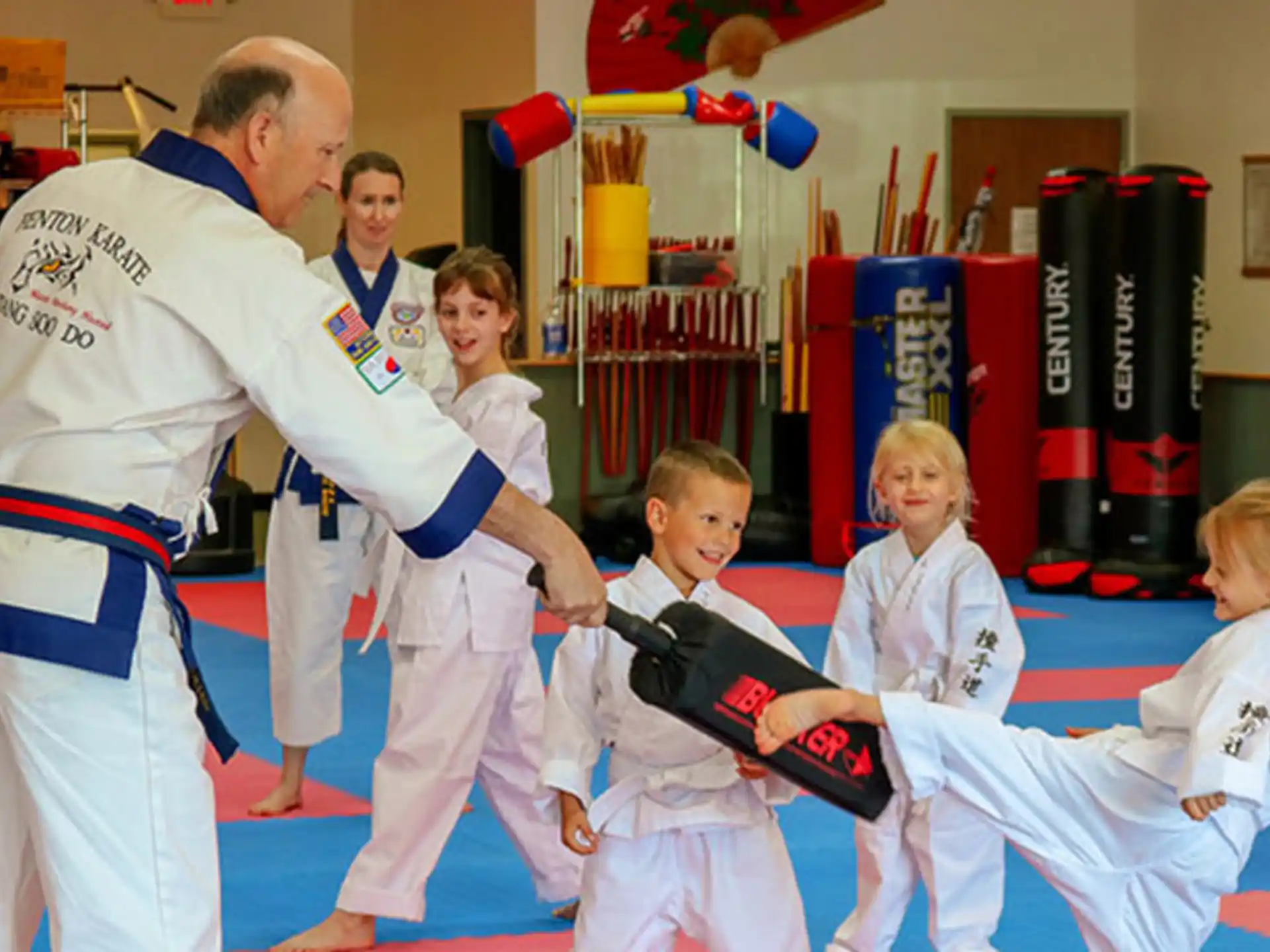 a group of people in karate uniforms