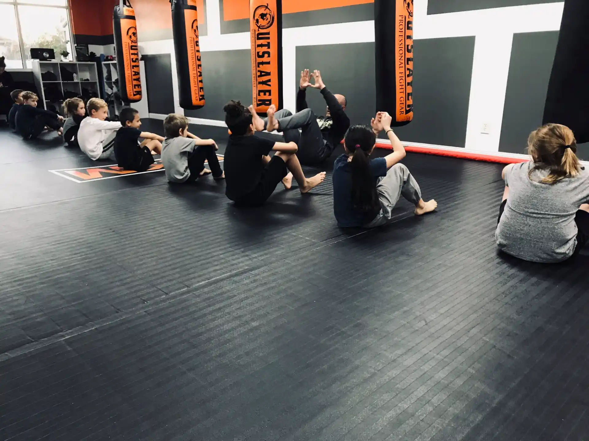 a group of people sitting on the floor