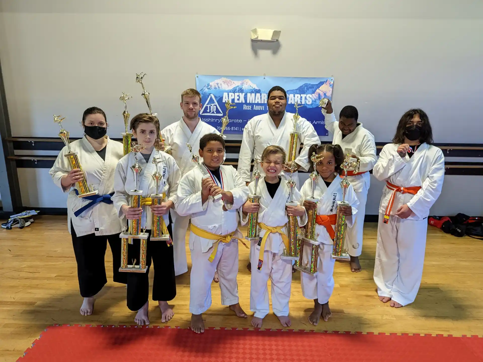 a group of people in karate uniforms