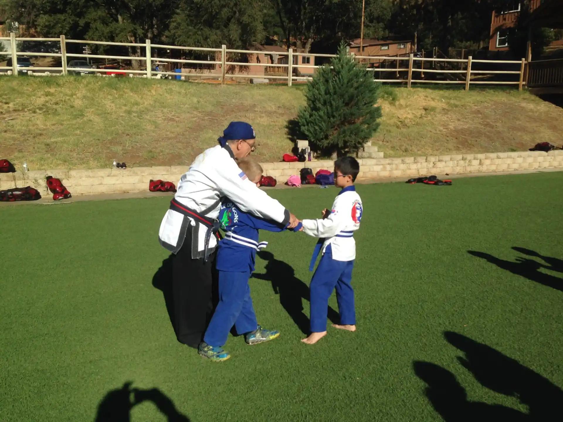 a person and a boy playing baseball