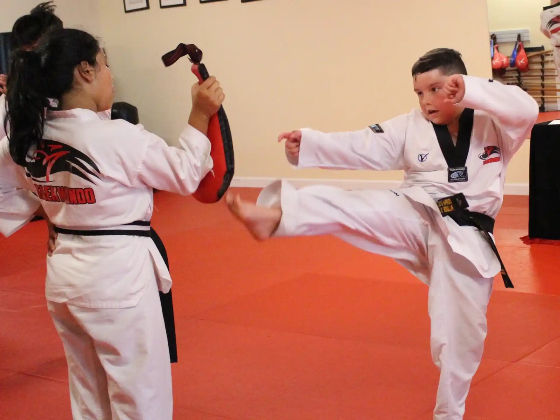 a man and woman in karate uniforms