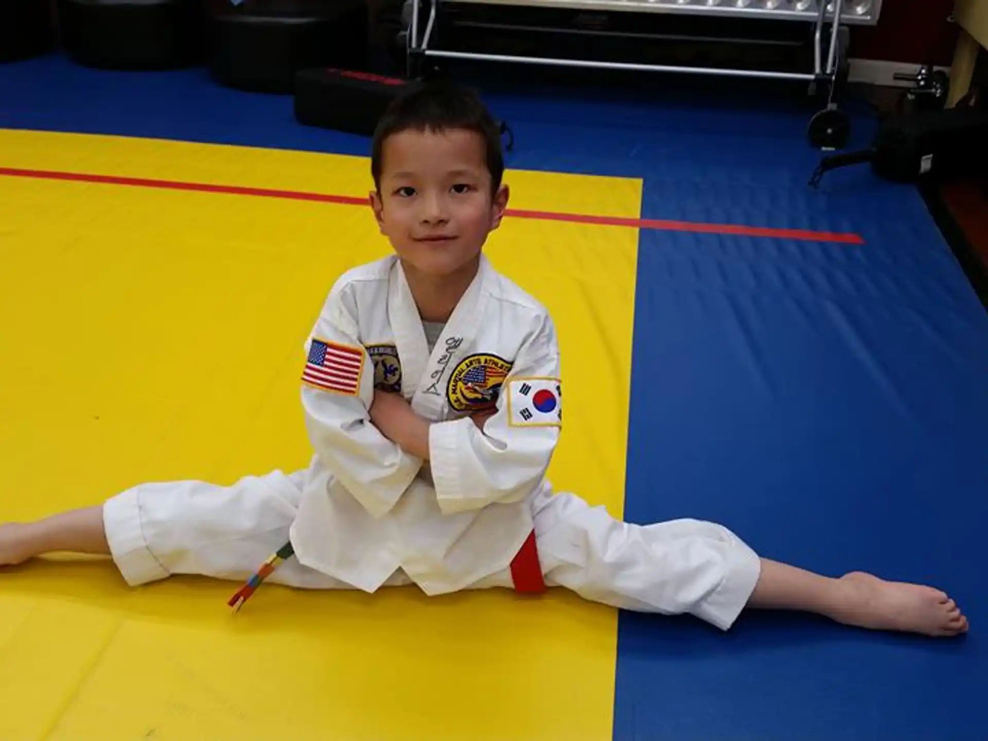 a boy in a karate uniform