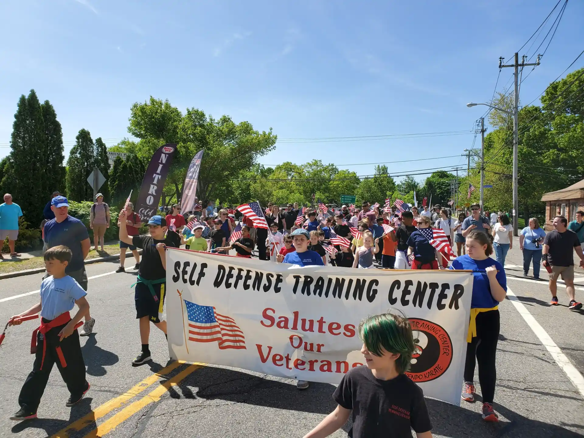 a group of people marching with a banner