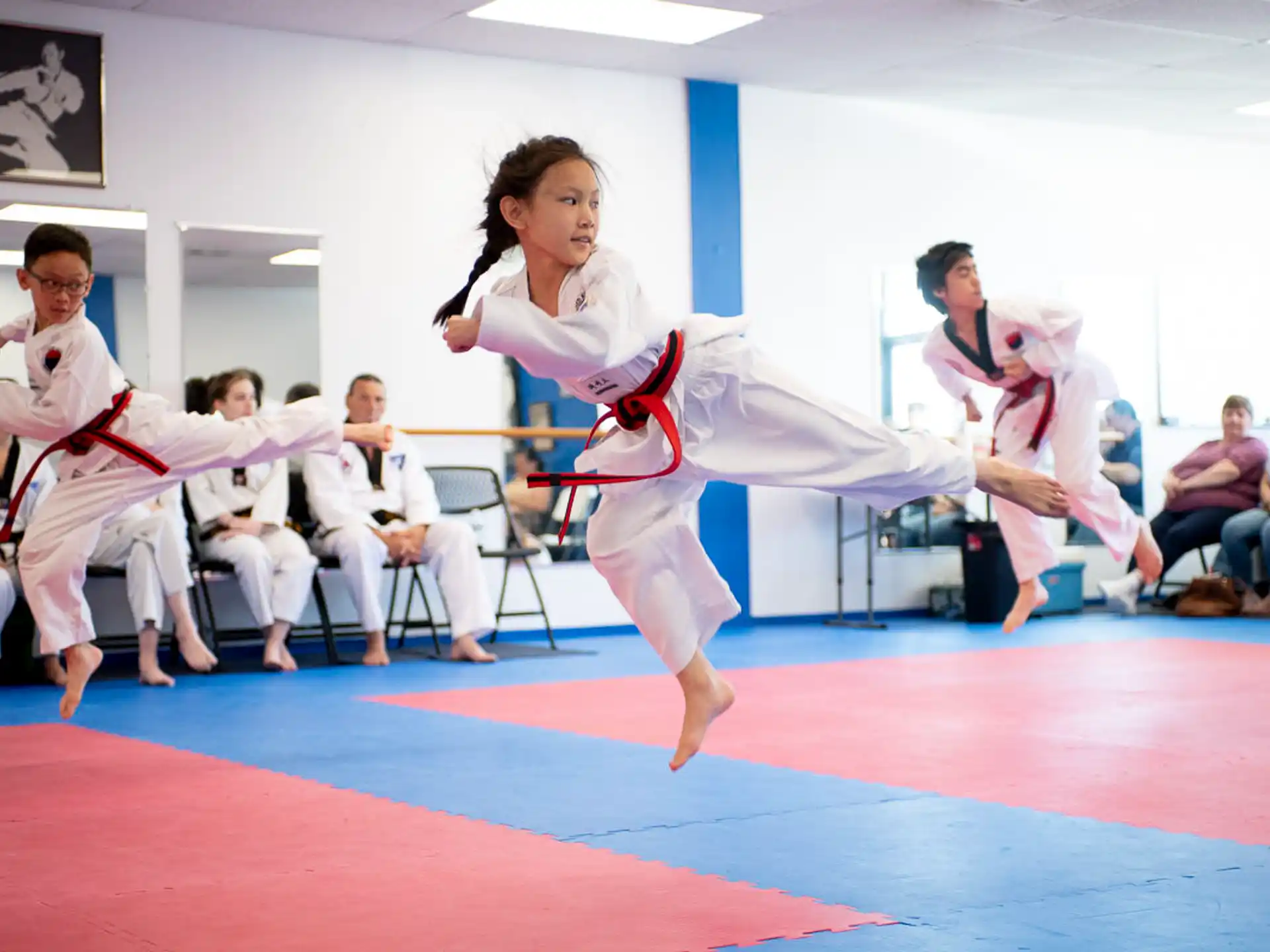 a group of people in karate uniforms