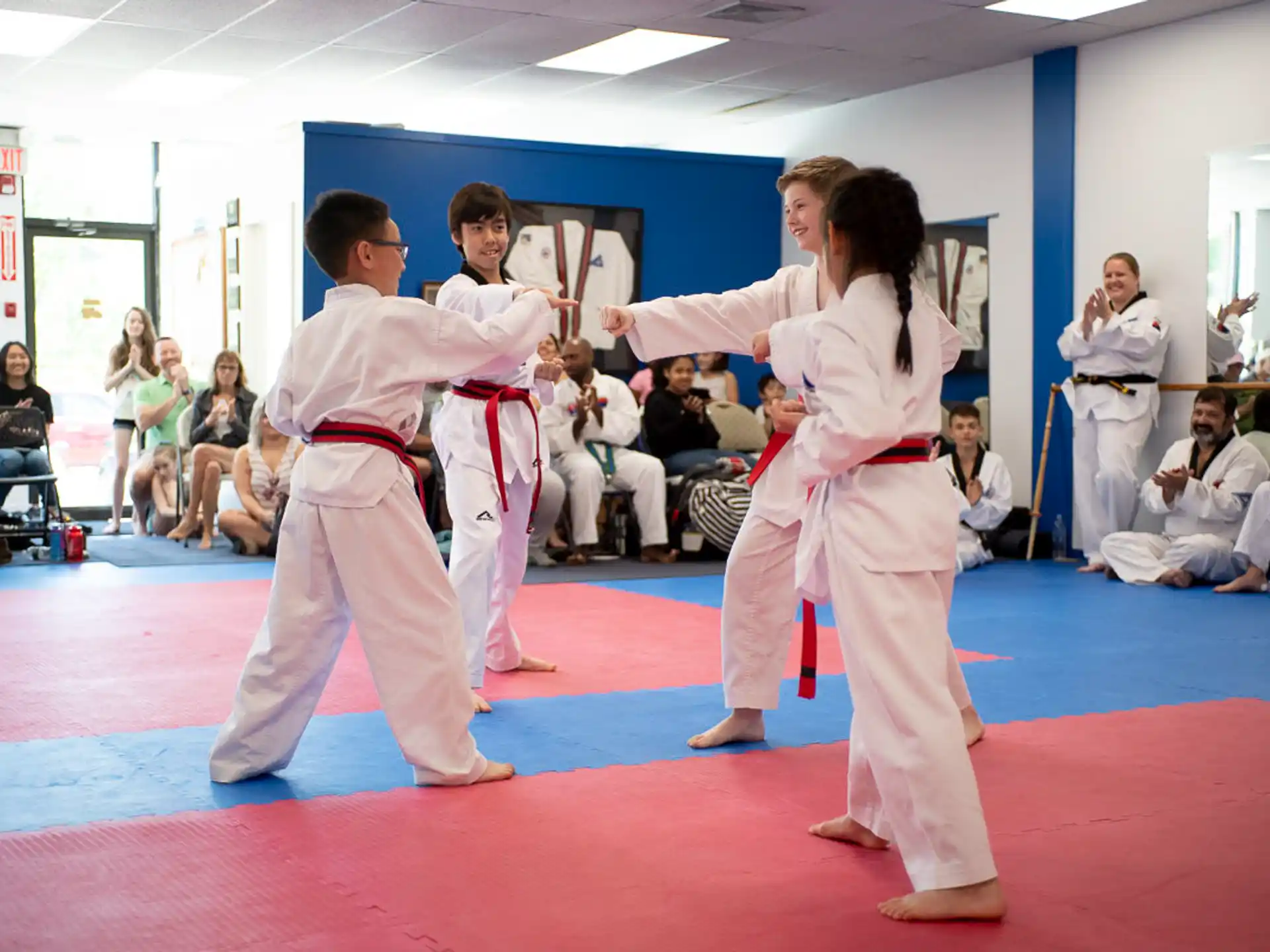 a group of people in karate uniforms