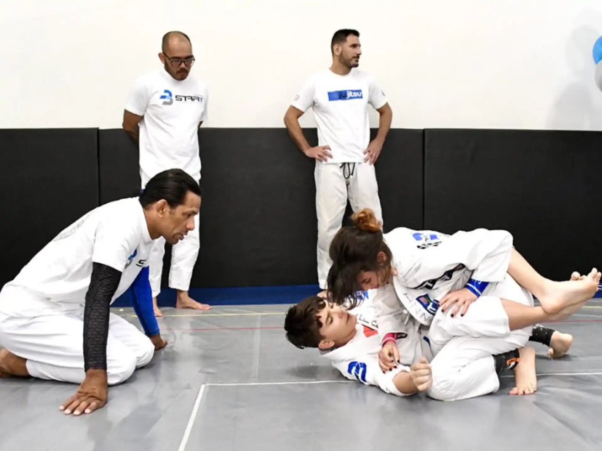 a group of people in karate uniforms
