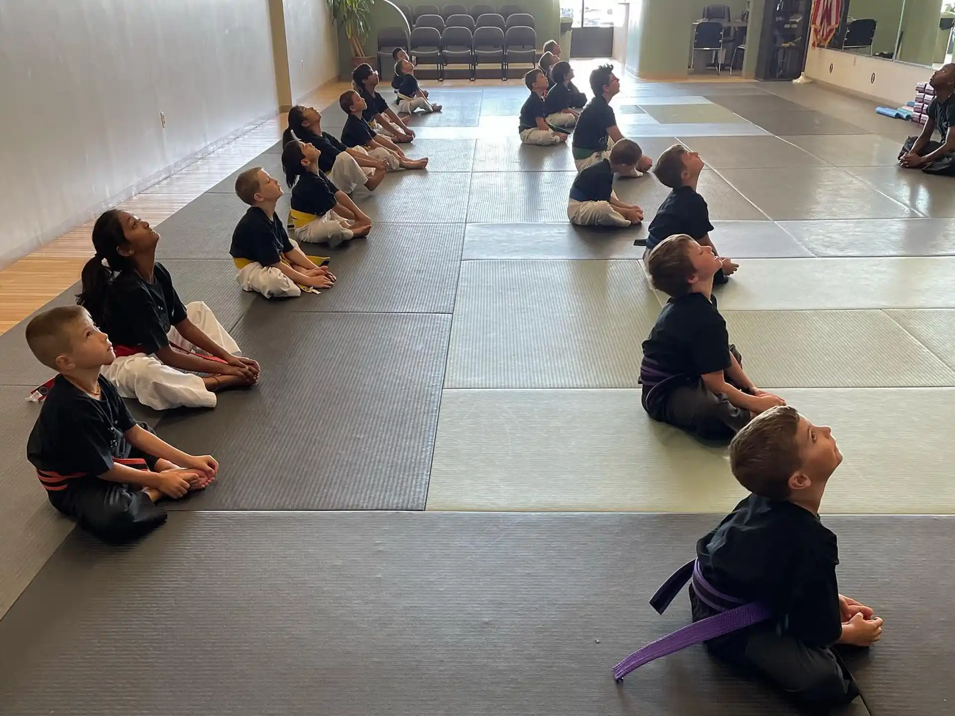 a group of people sitting on the floor