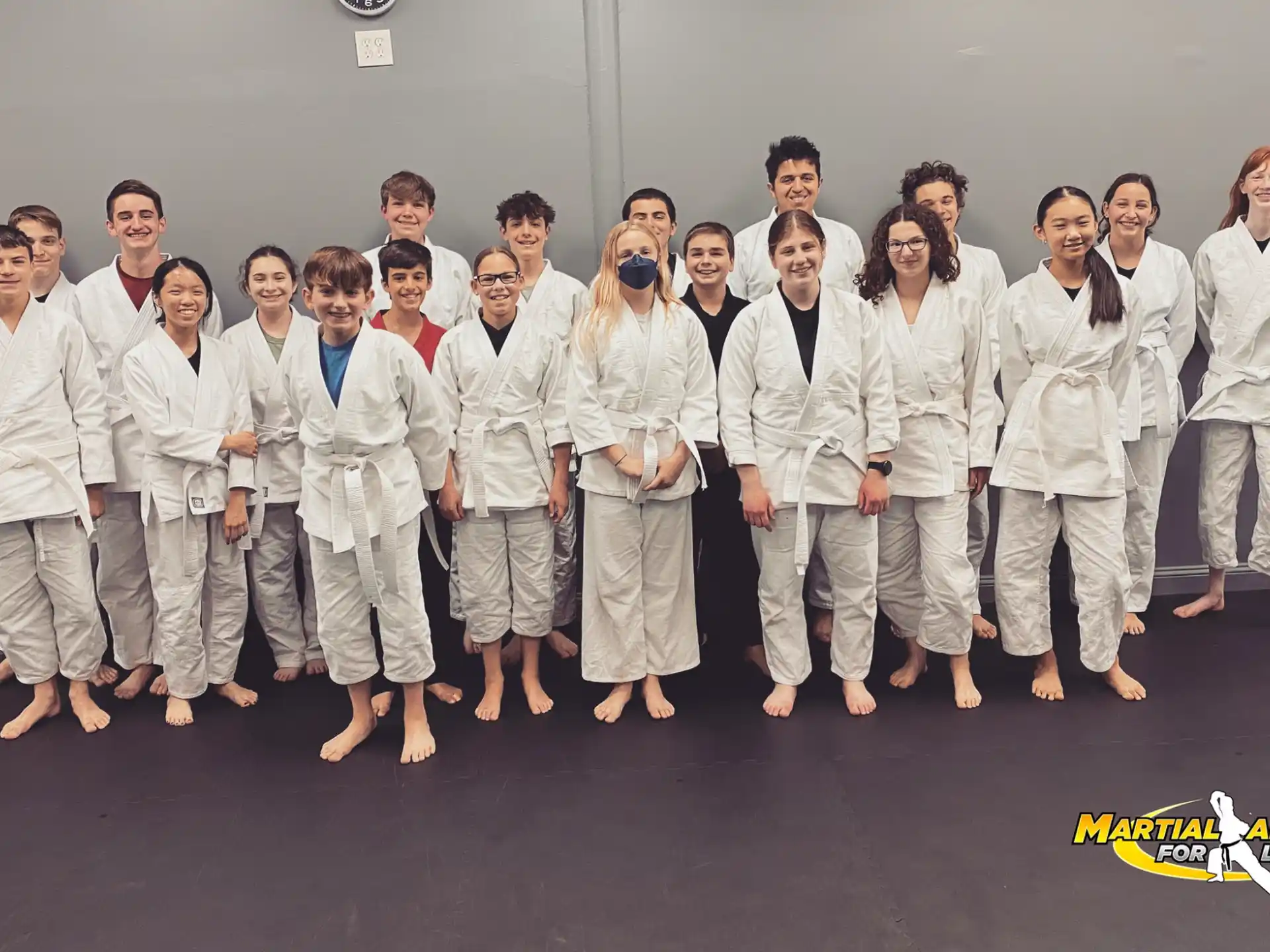a group of people in white lab coats