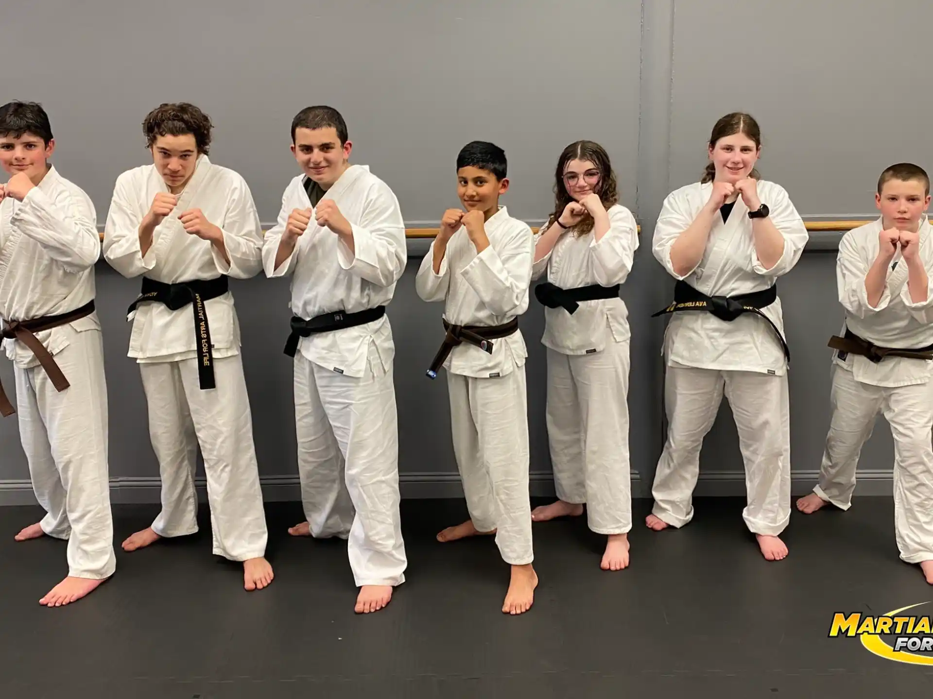 a group of people wearing karate uniforms