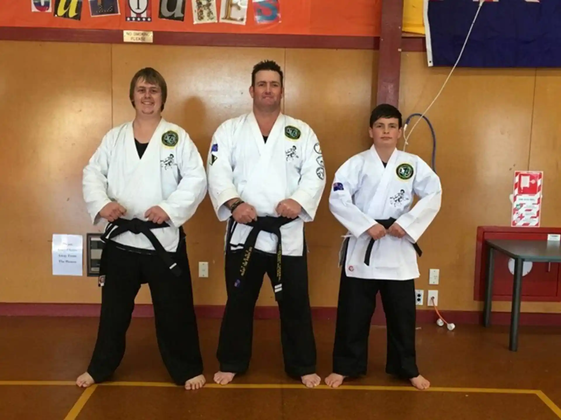 a group of men in karate uniforms