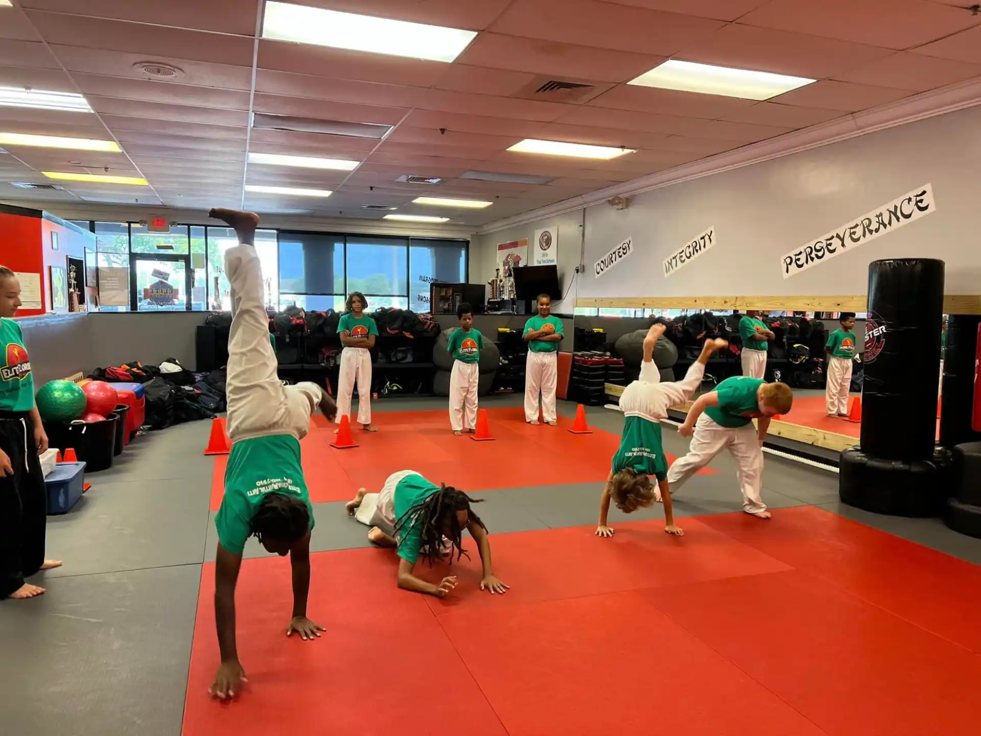 a group of people exercising in a gym