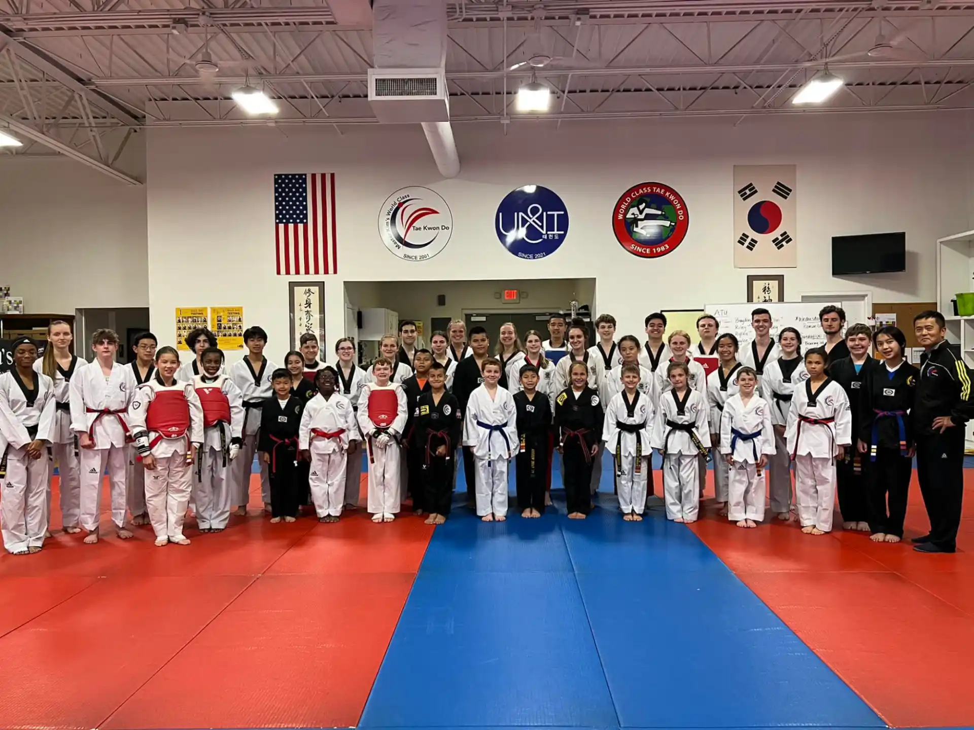 a group of people in karate uniforms