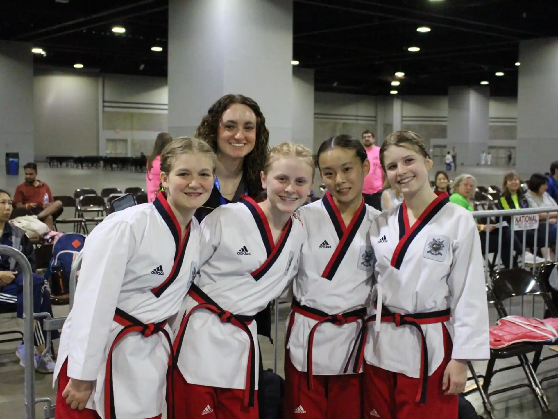 a group of women in matching outfits