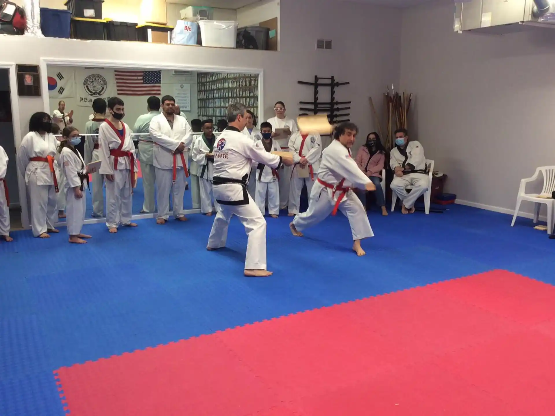 a group of people in karate uniforms