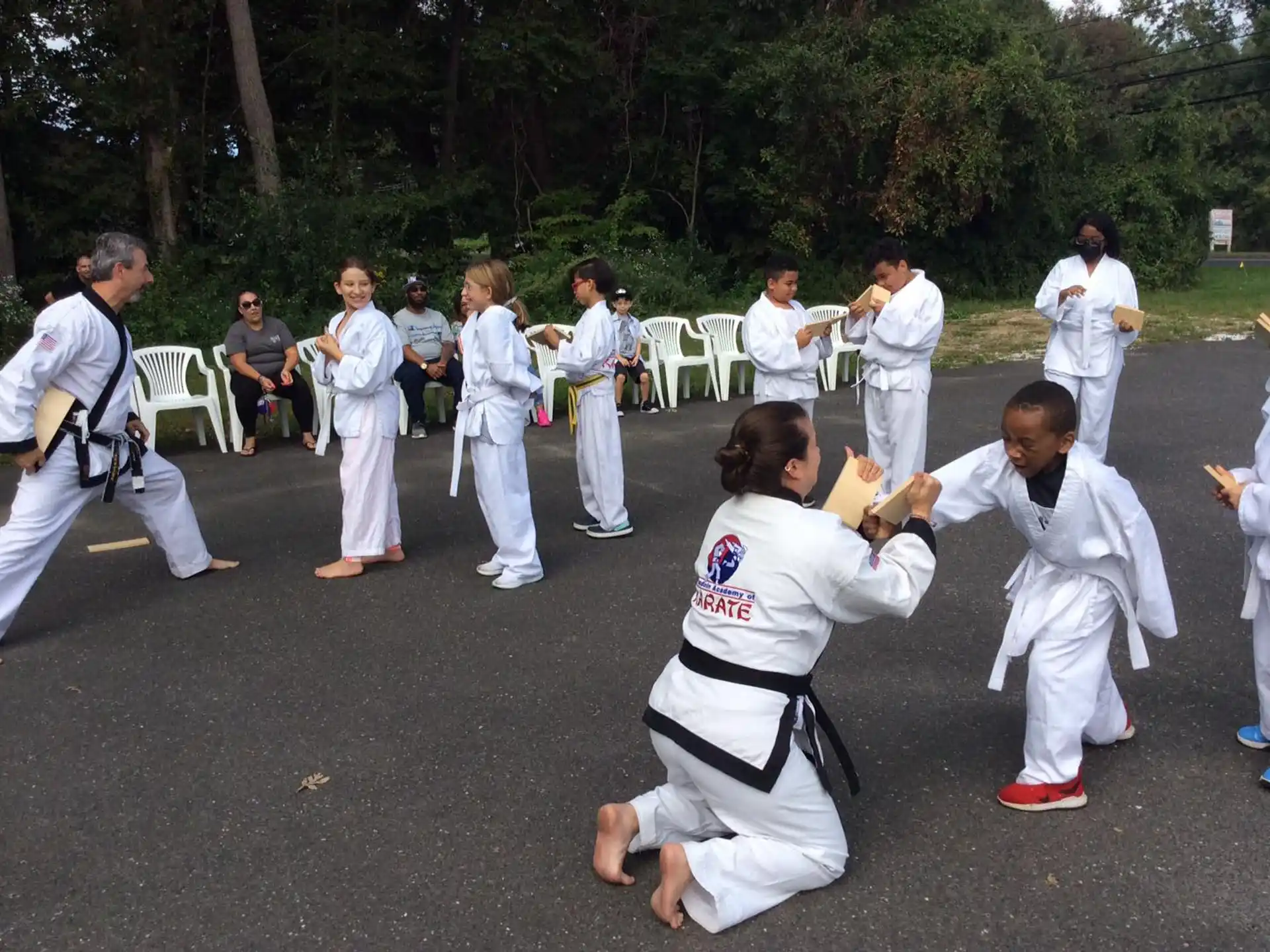 a group of people in karate uniforms