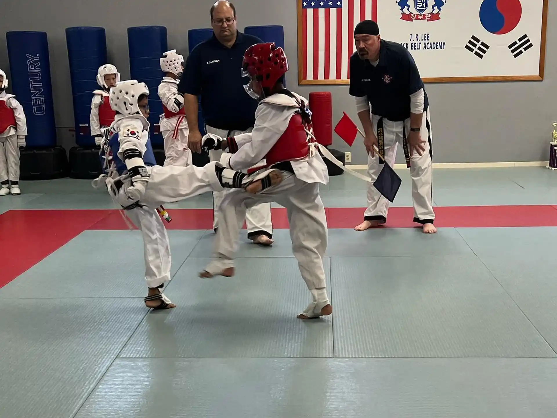 a group of people in white karate uniforms