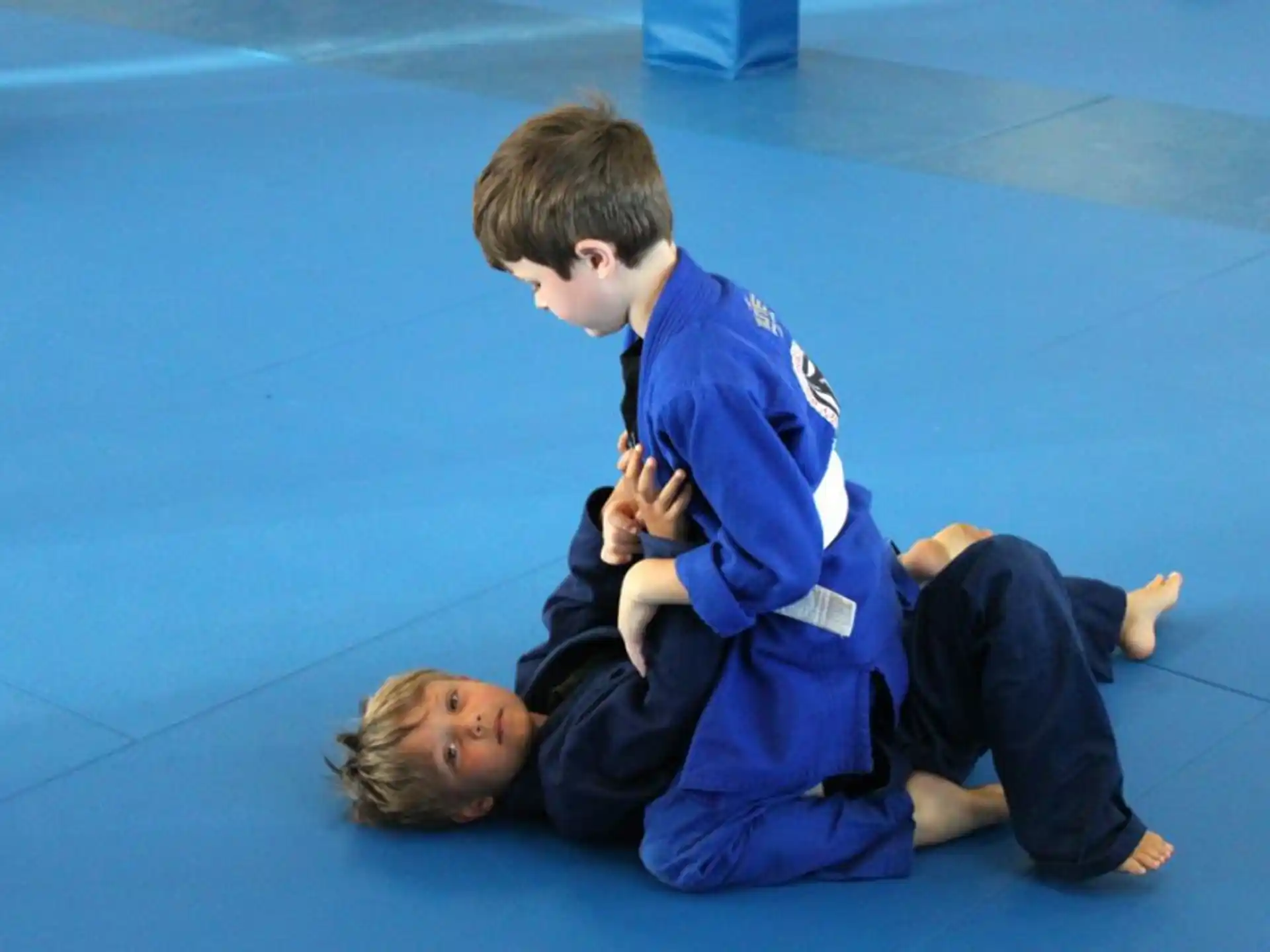 a boy and girl sitting on the floor