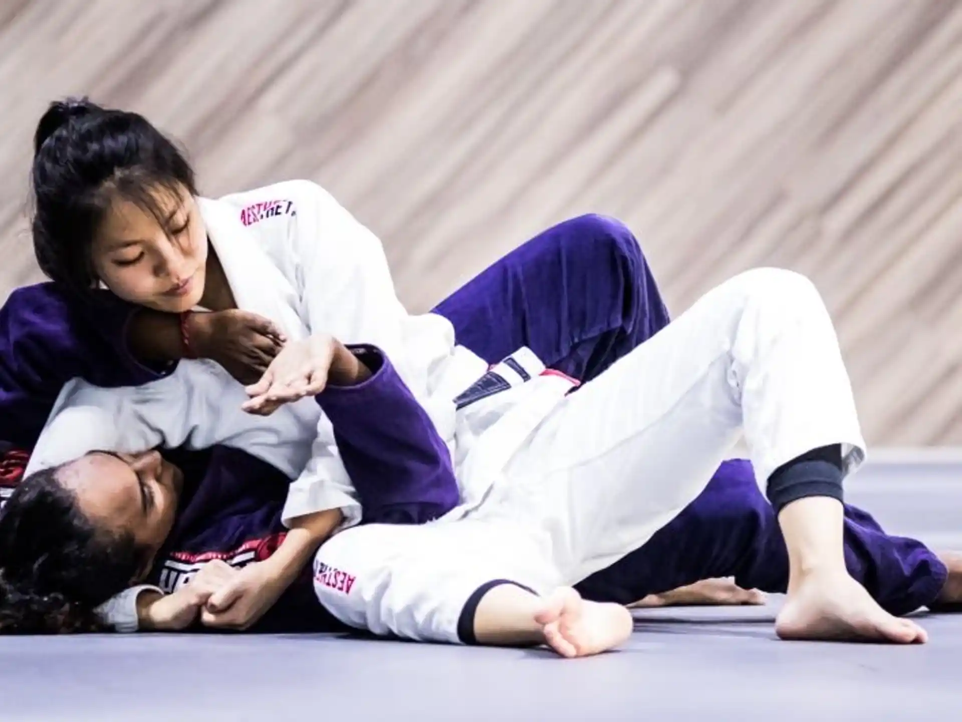a man and woman lying on the ground