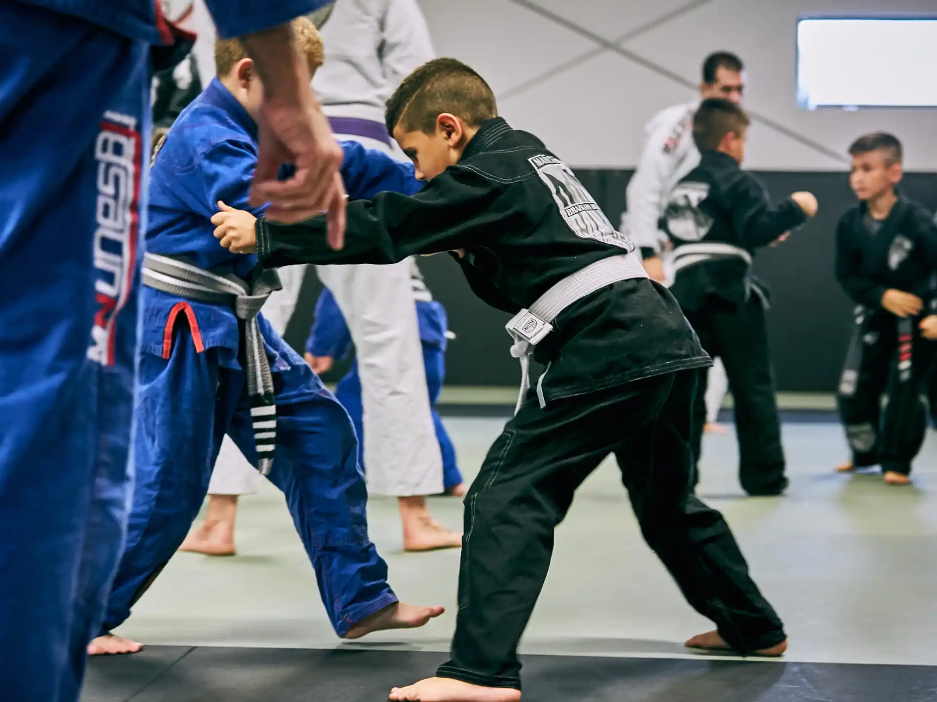 a group of people in a martial arts class