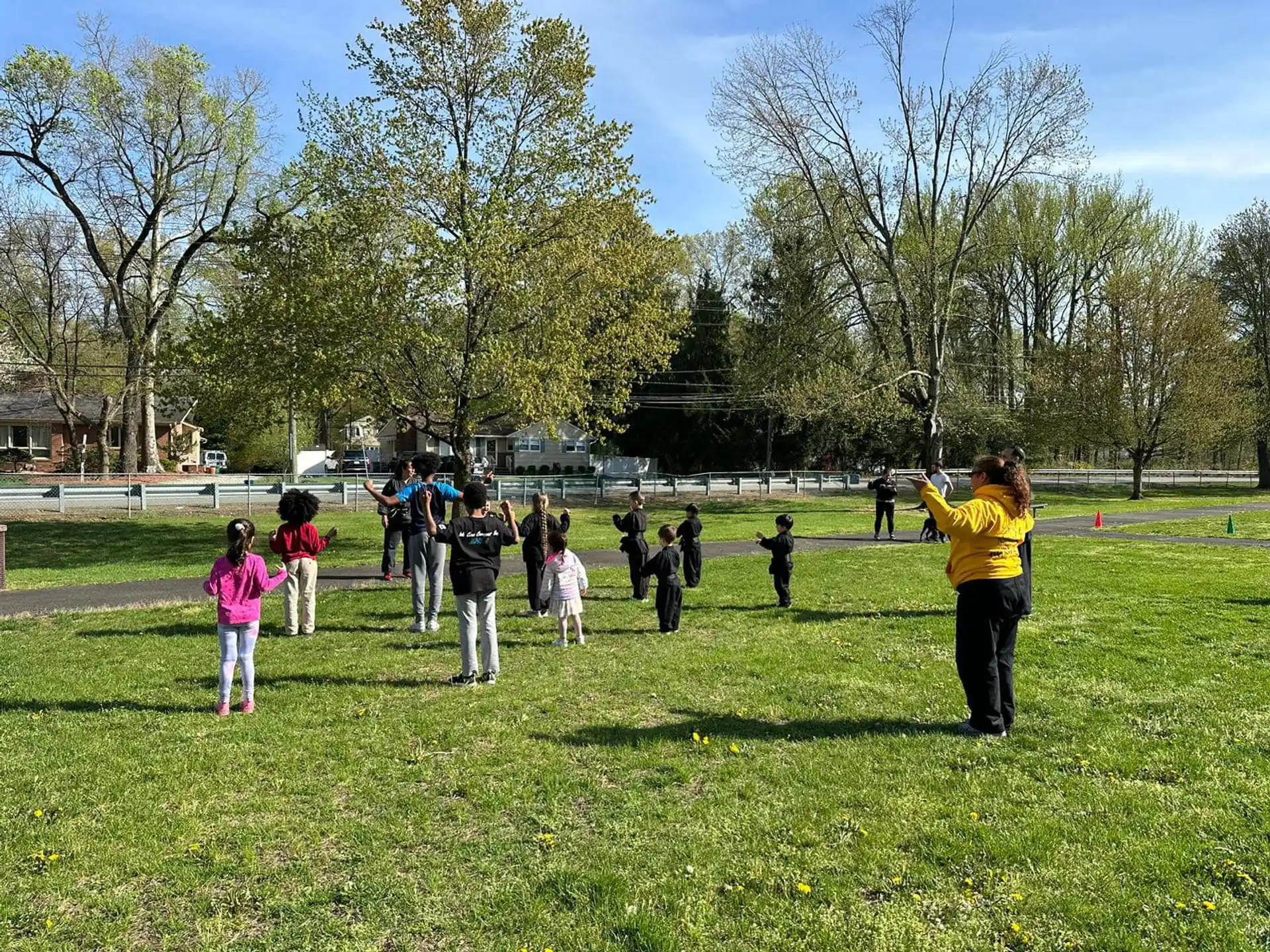 a group of people playing in a park