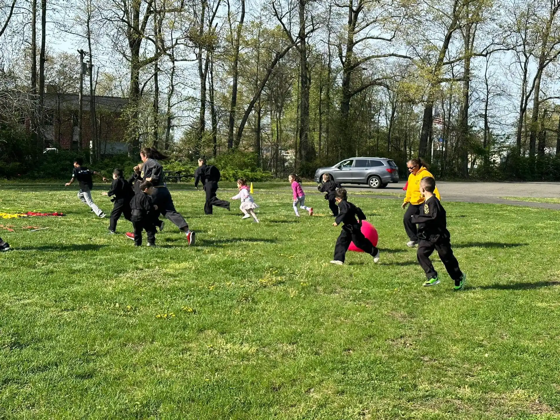a group of people playing with a frisbee