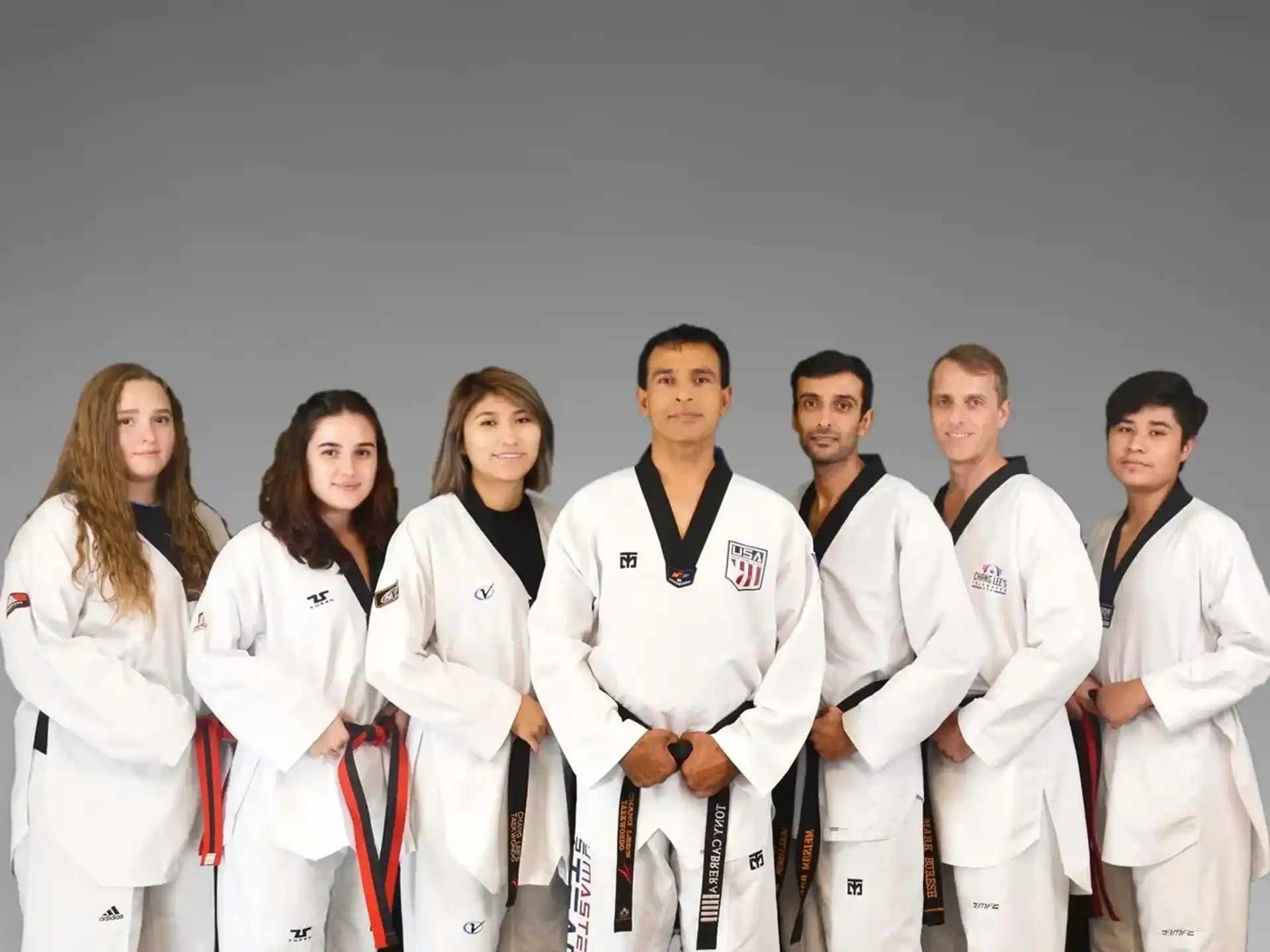a group of people in white lab coats