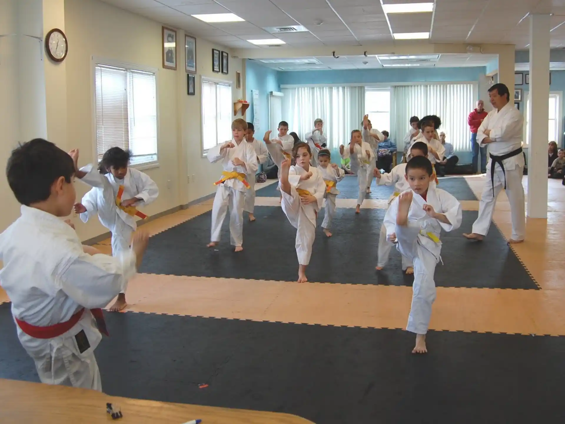 a group of people in karate uniforms