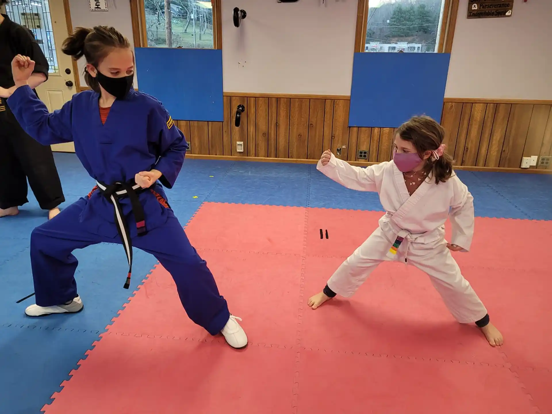 a group of girls practicing karate
