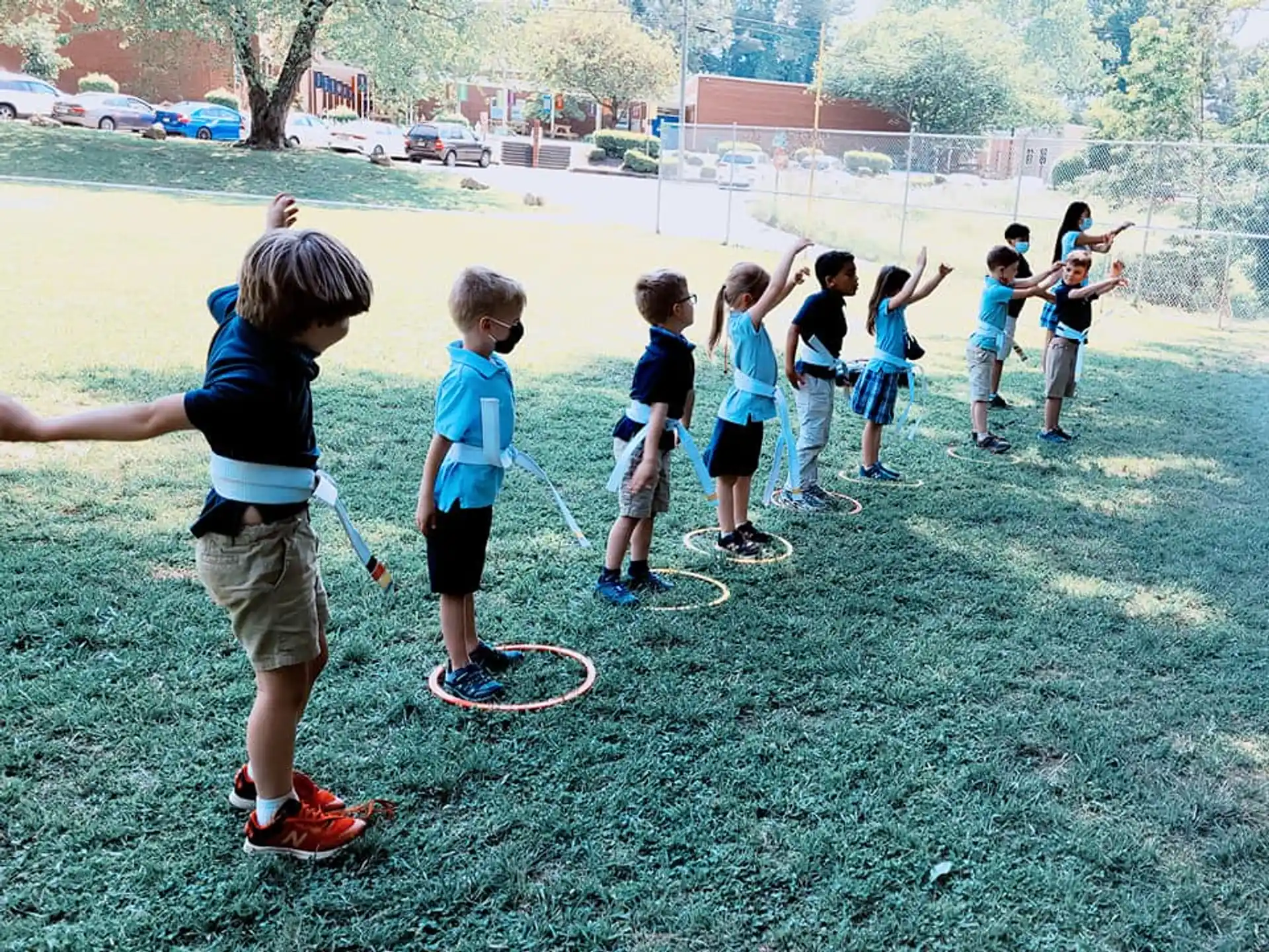 a group of kids playing with sticks
