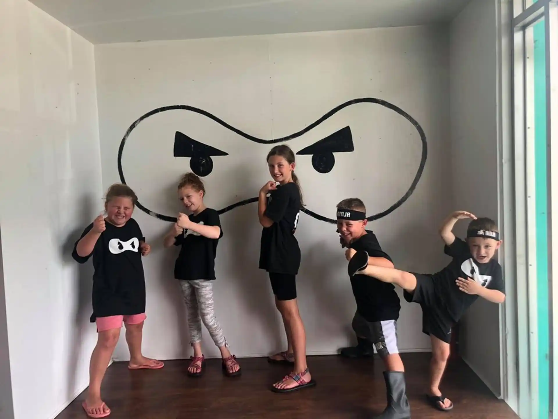 a group of kids posing for a picture