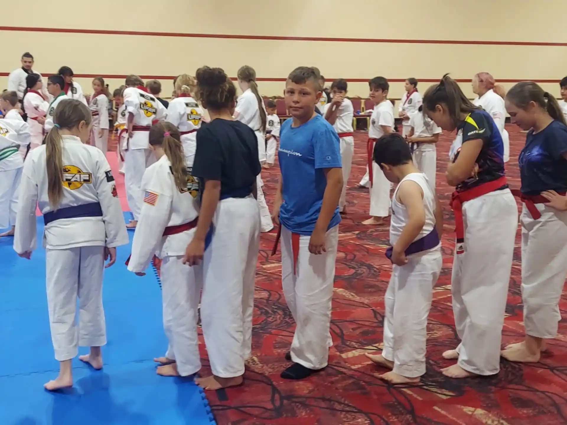 a group of people in karate uniforms