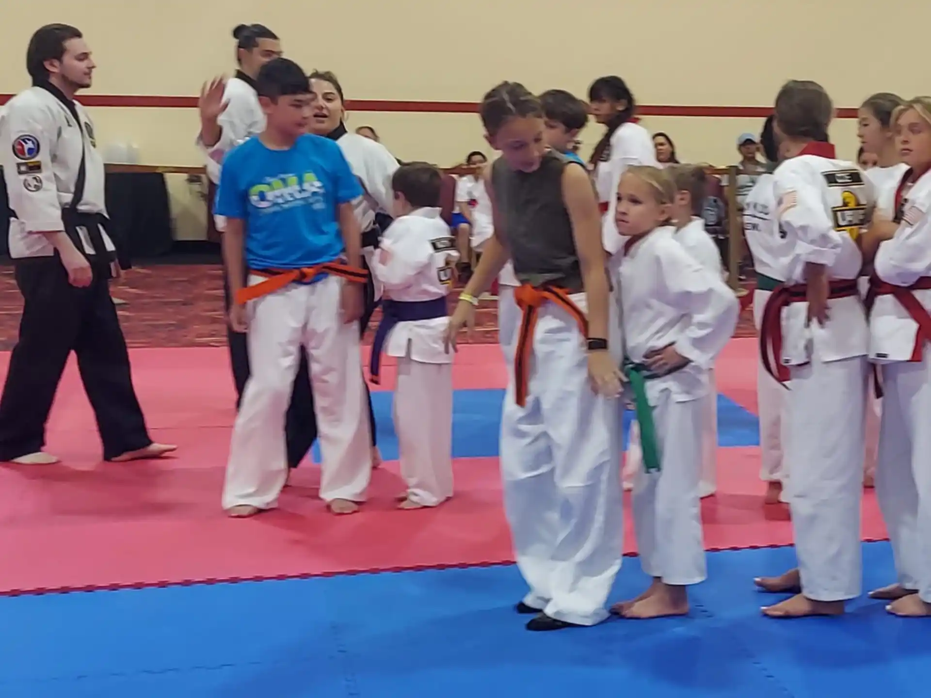 a group of people in karate uniforms