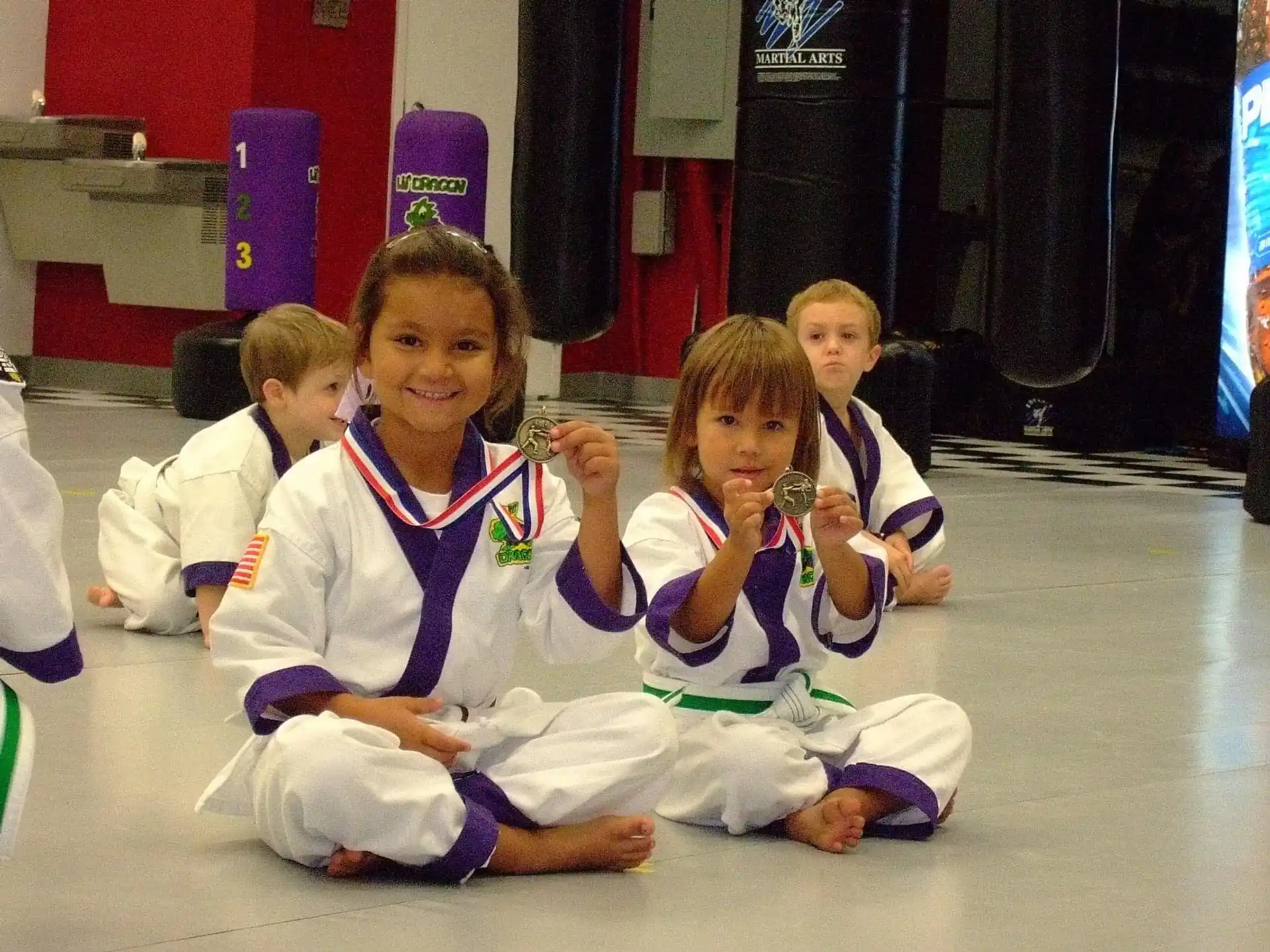 a group of children wearing medals