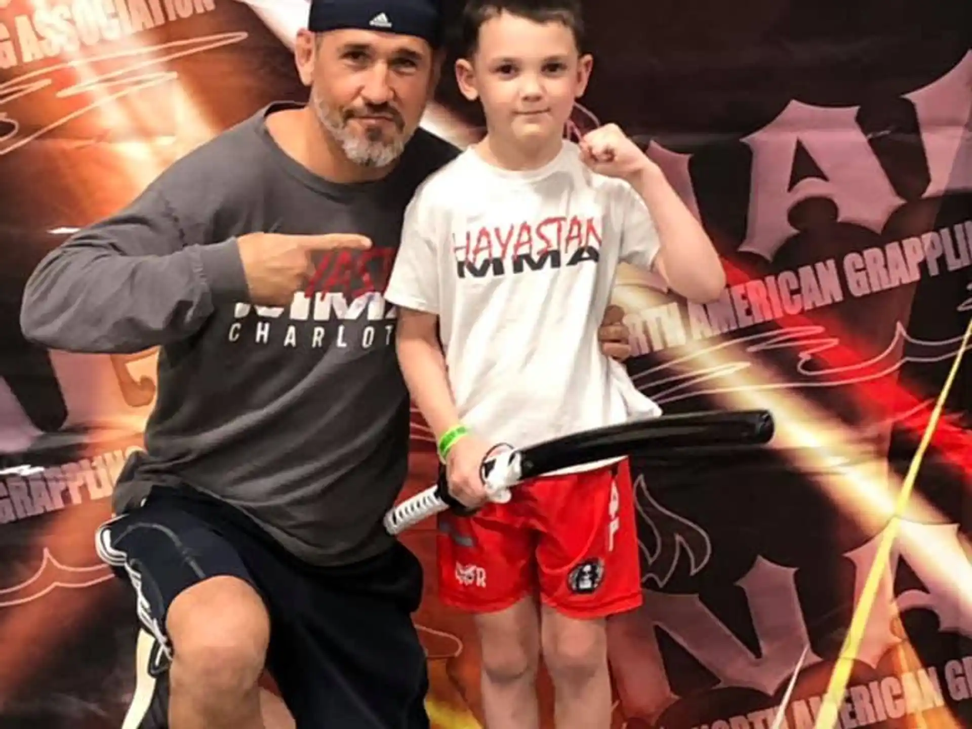 a person and a boy posing for a picture