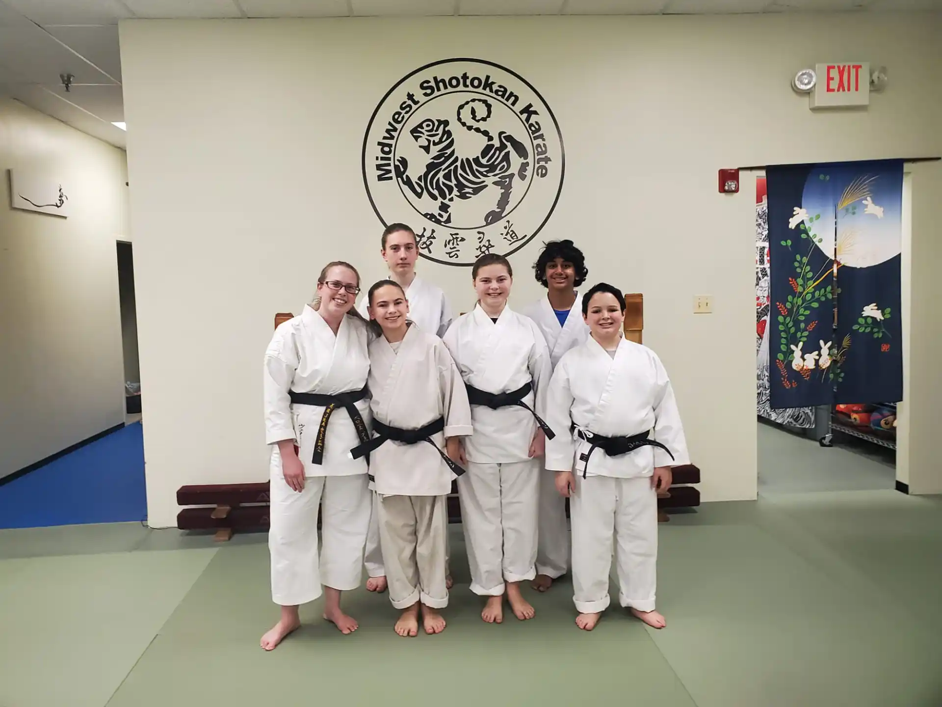 a group of people in white uniforms