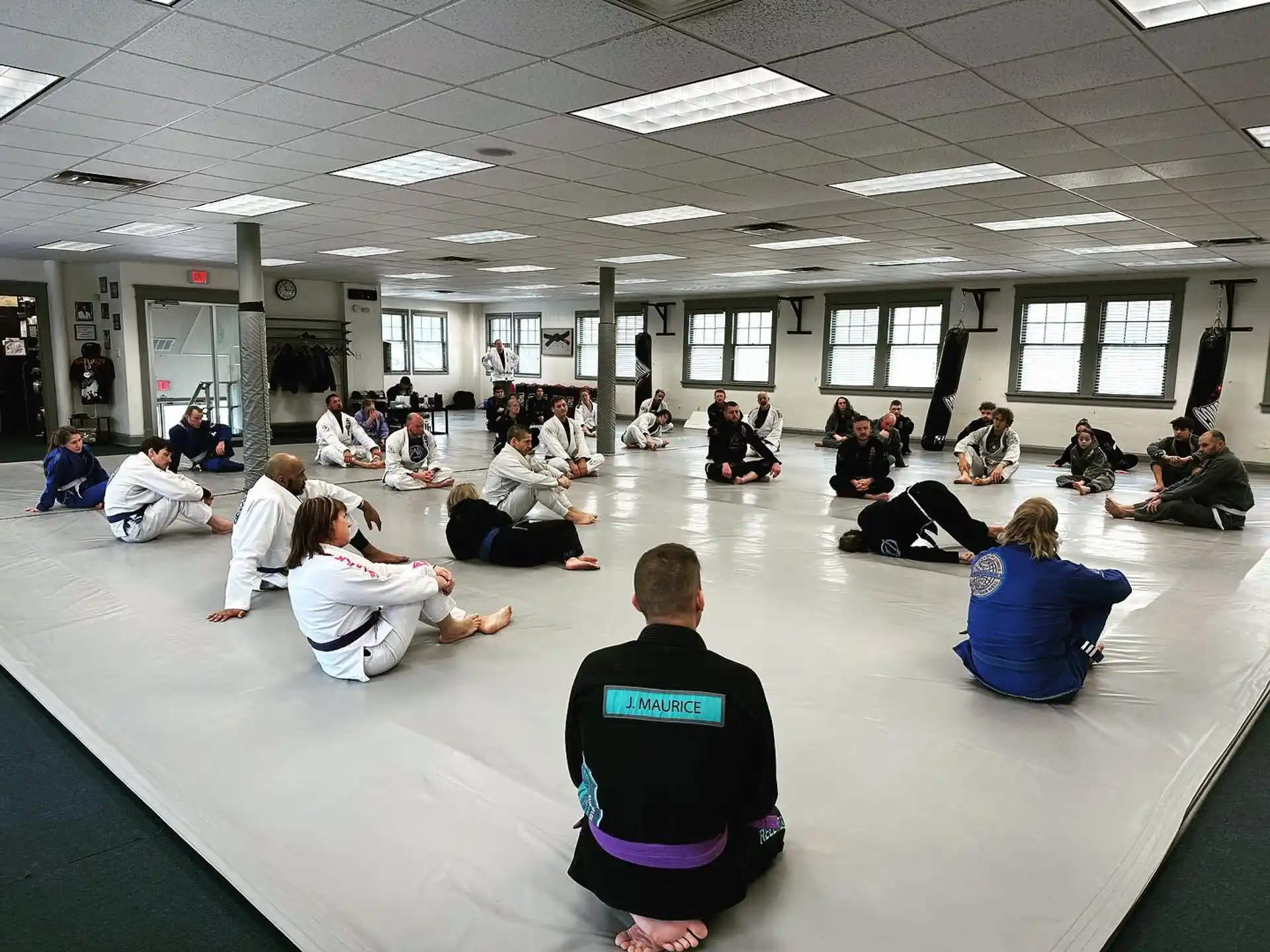 a group of people sitting in a circle in a room