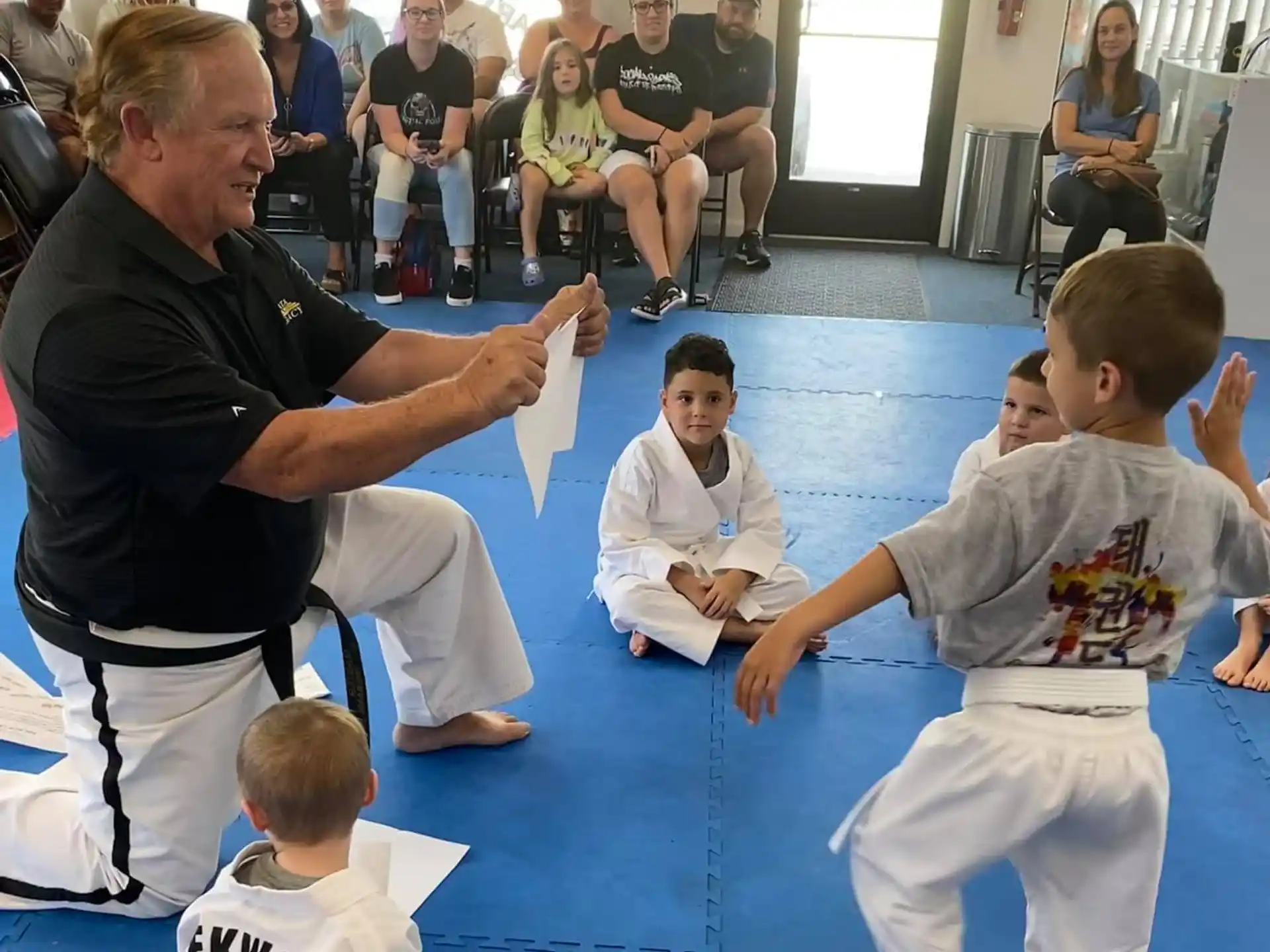 a person teaching children in a class