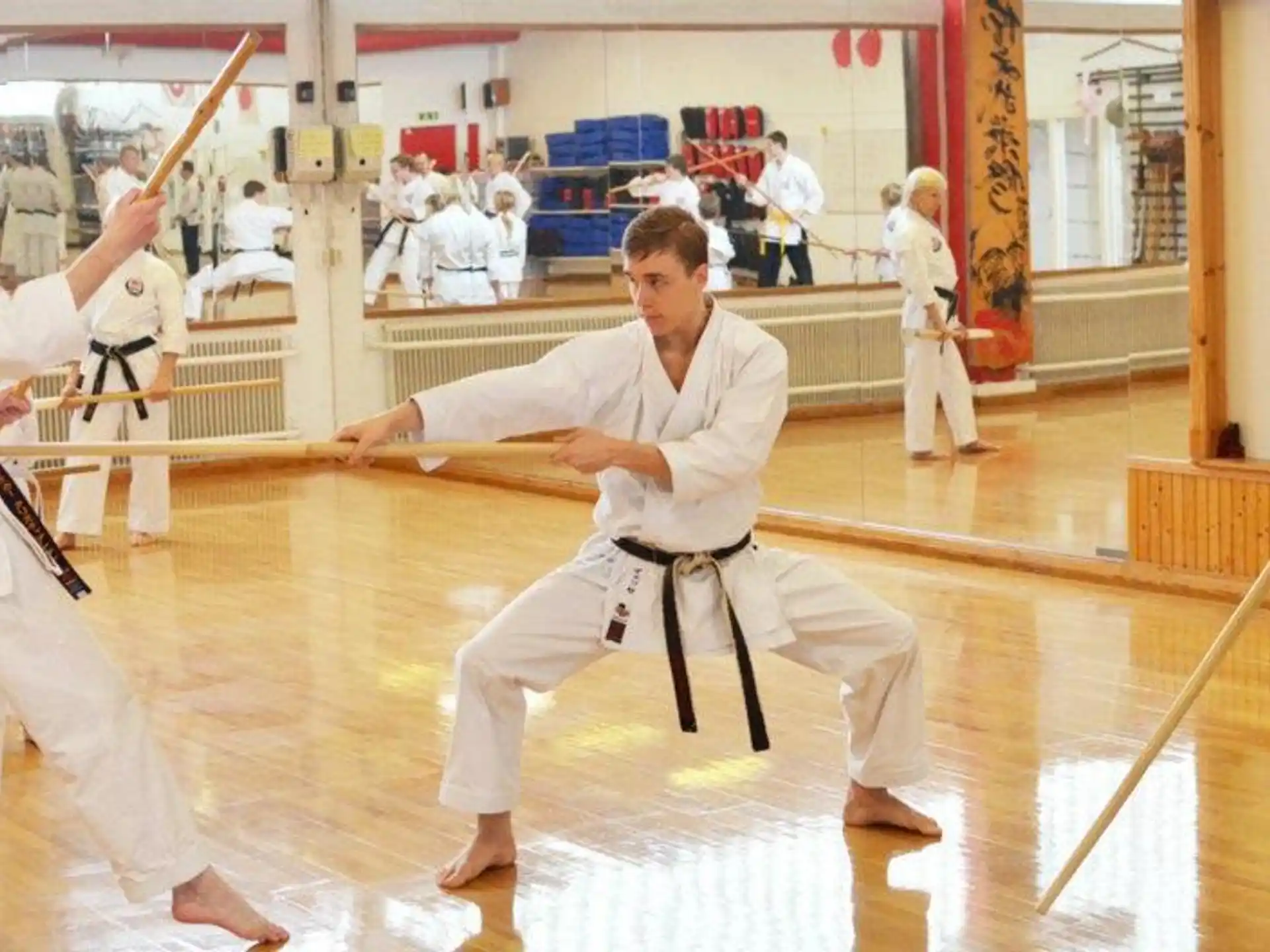 a group of people in karate uniforms