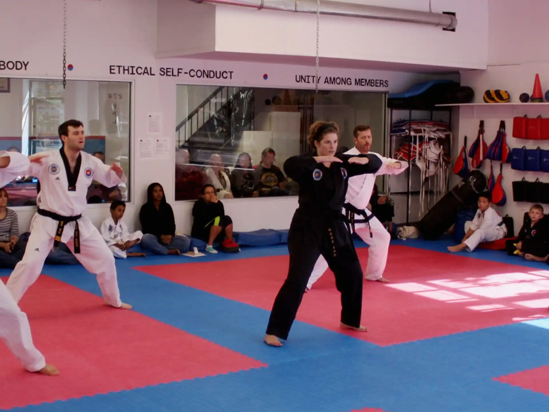 a group of people in karate uniforms