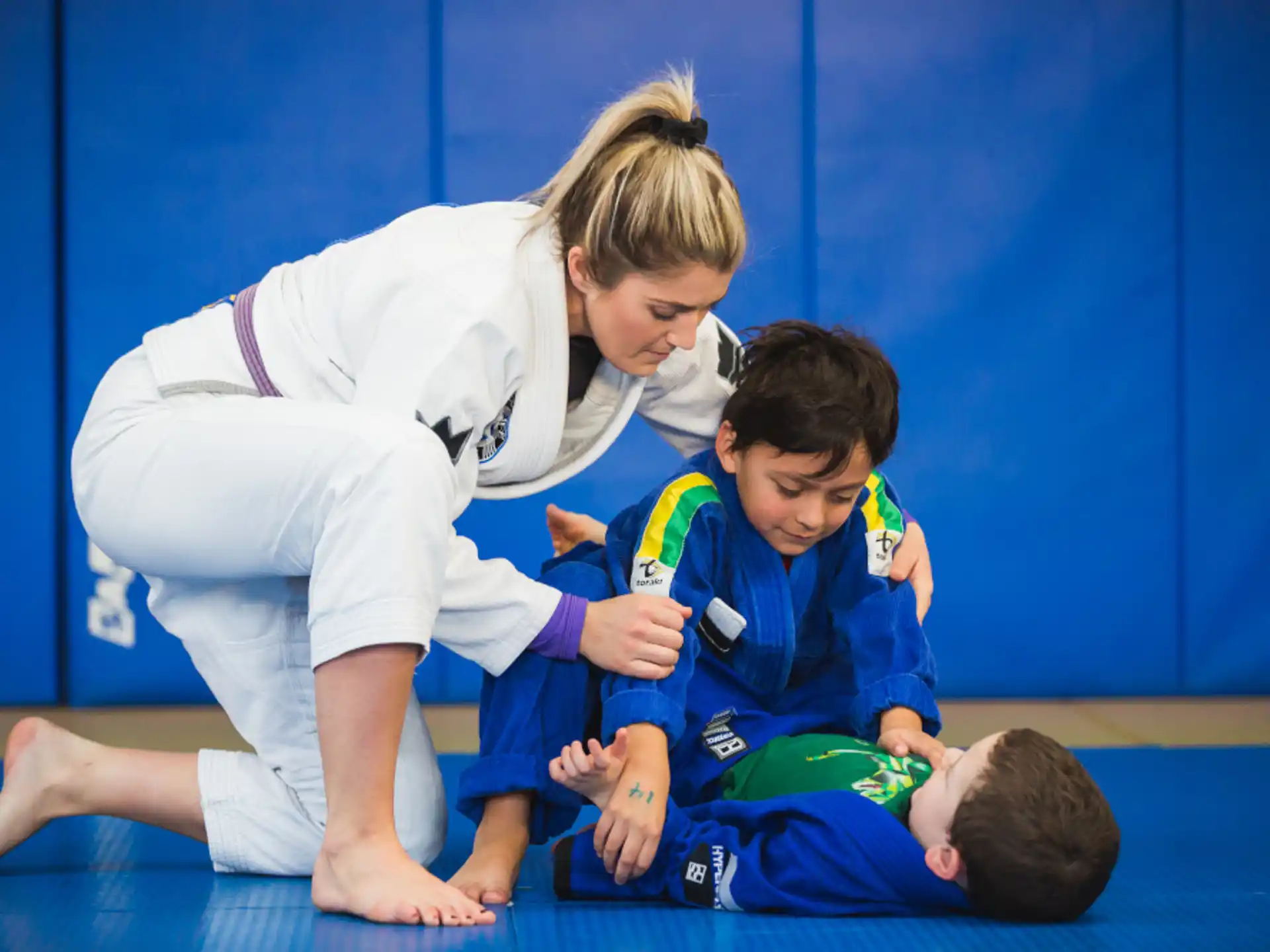 a person helping a boy with the hands