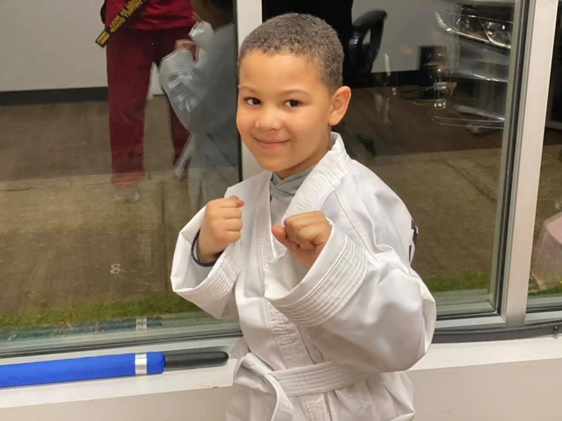 a boy in a white robe