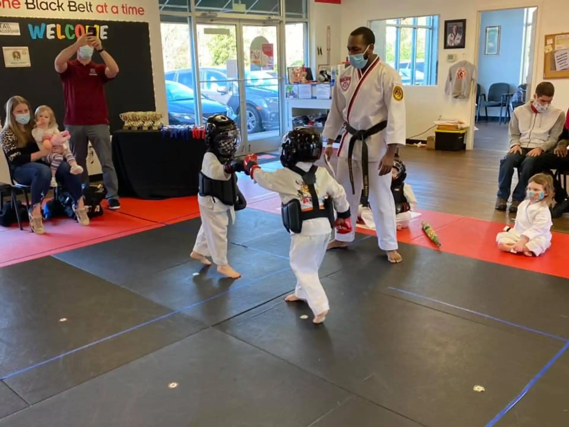 a group of people in a karate class