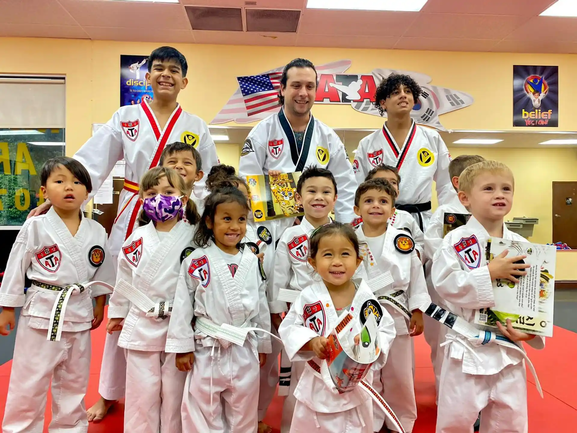a group of people in karate uniforms