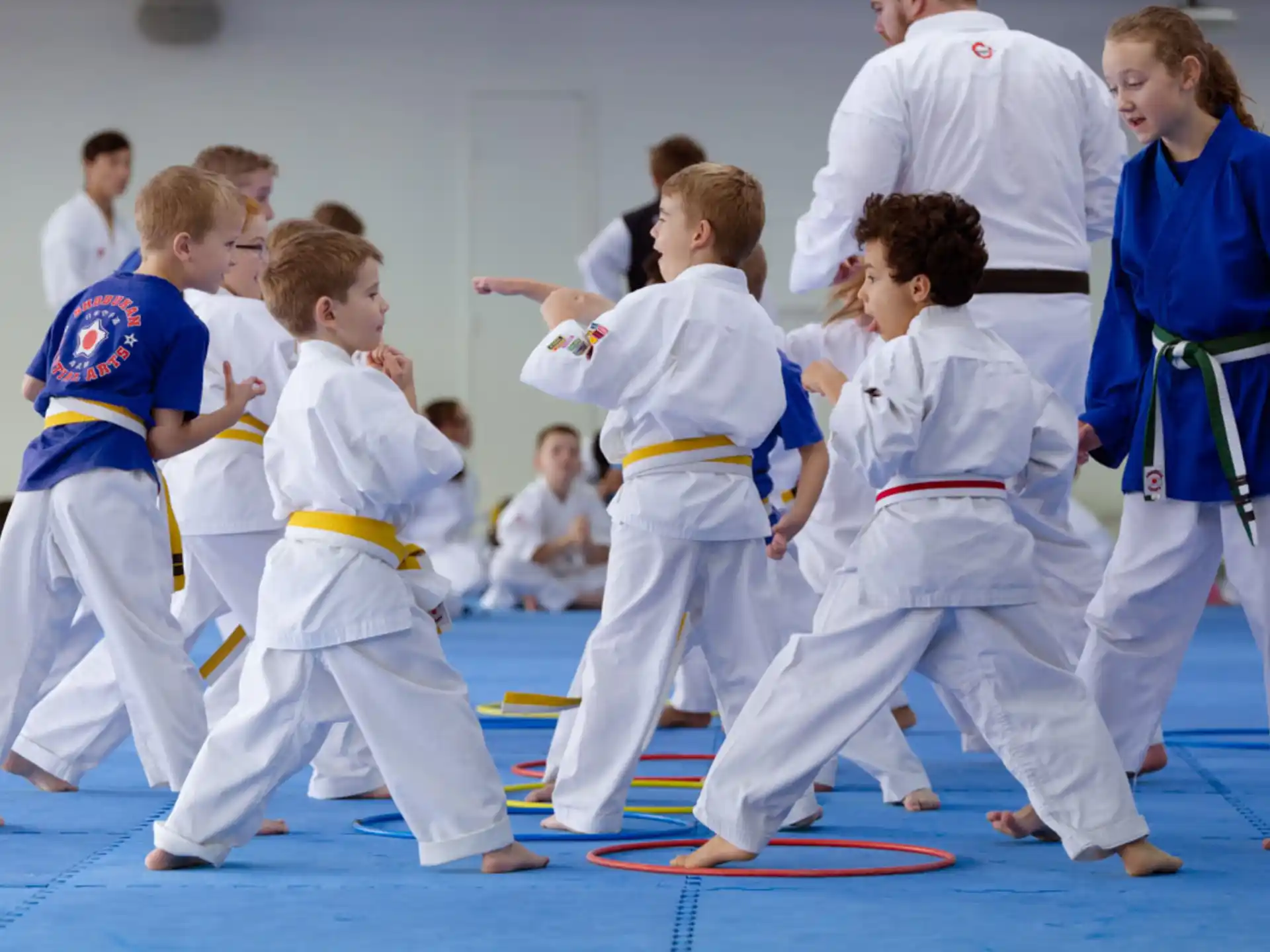 a group of people in karate uniforms